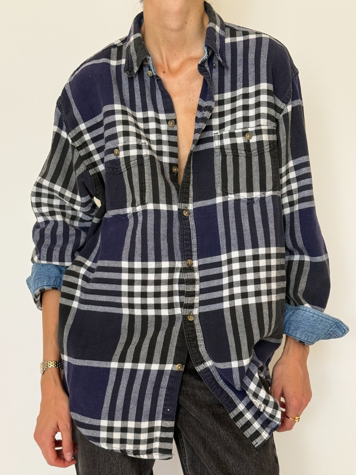 Close up of vintage navy plaid shirt collar buttons and chest pockets