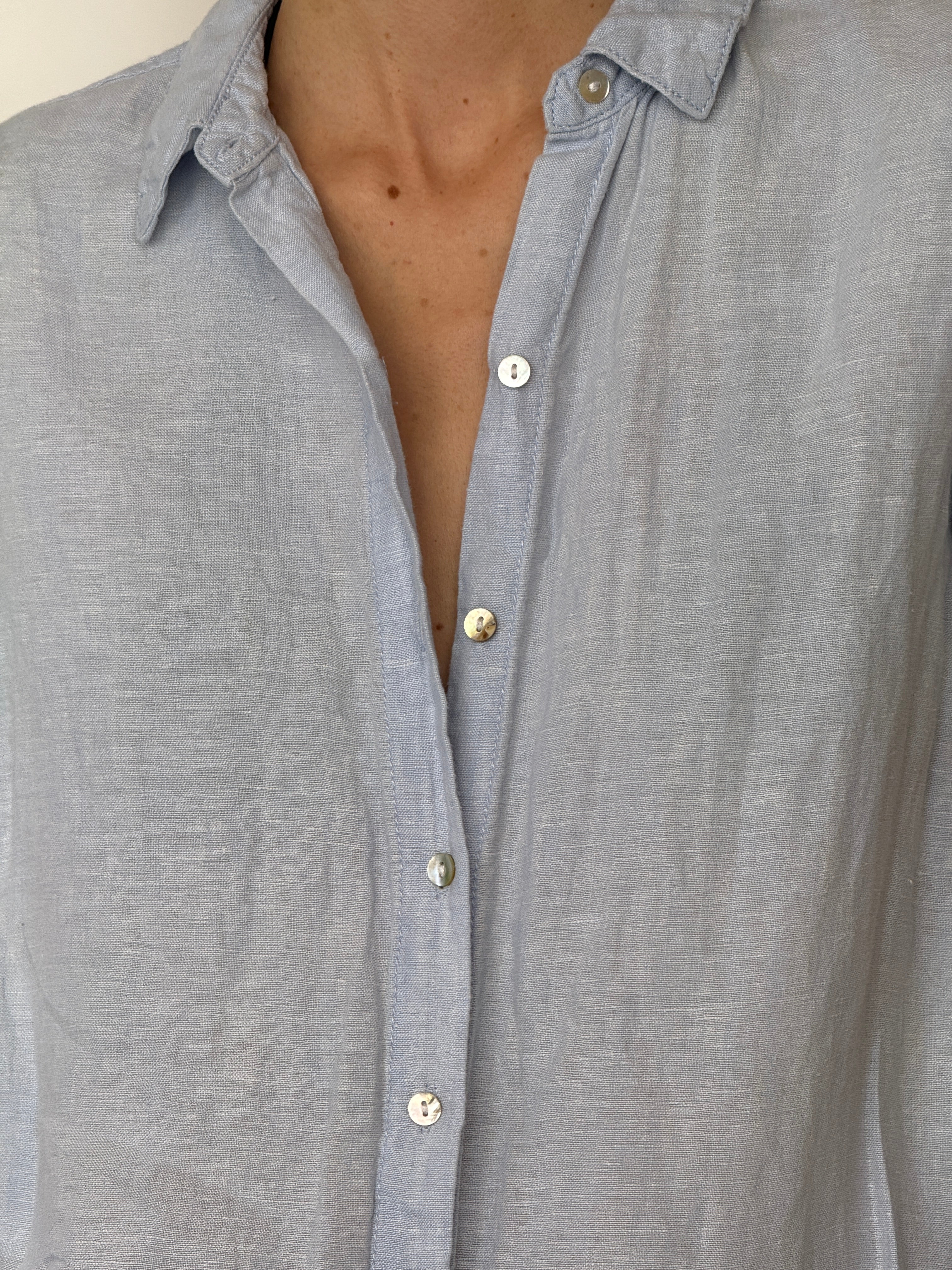 Vintage lightweight linen shirt dress with relaxed silhouette in light blue close-up