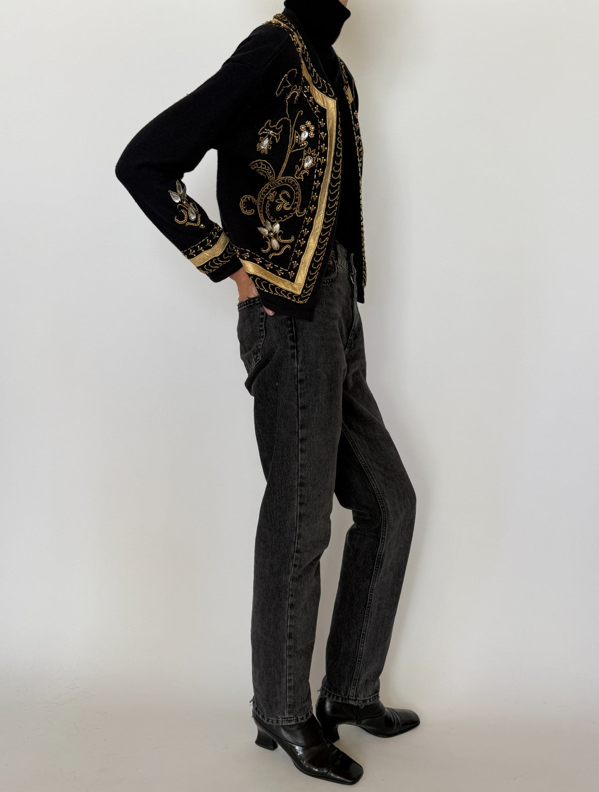 Full-length styled view of vintage black and gold cardigan