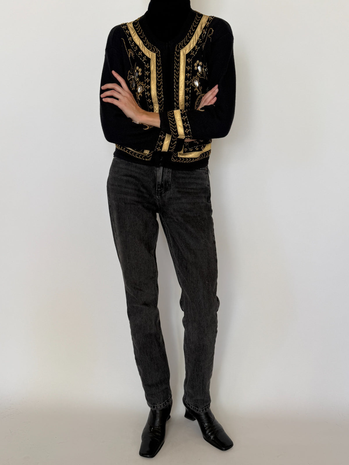 Front view of vintage black and gold embellished B.J. Kristensen cardigan