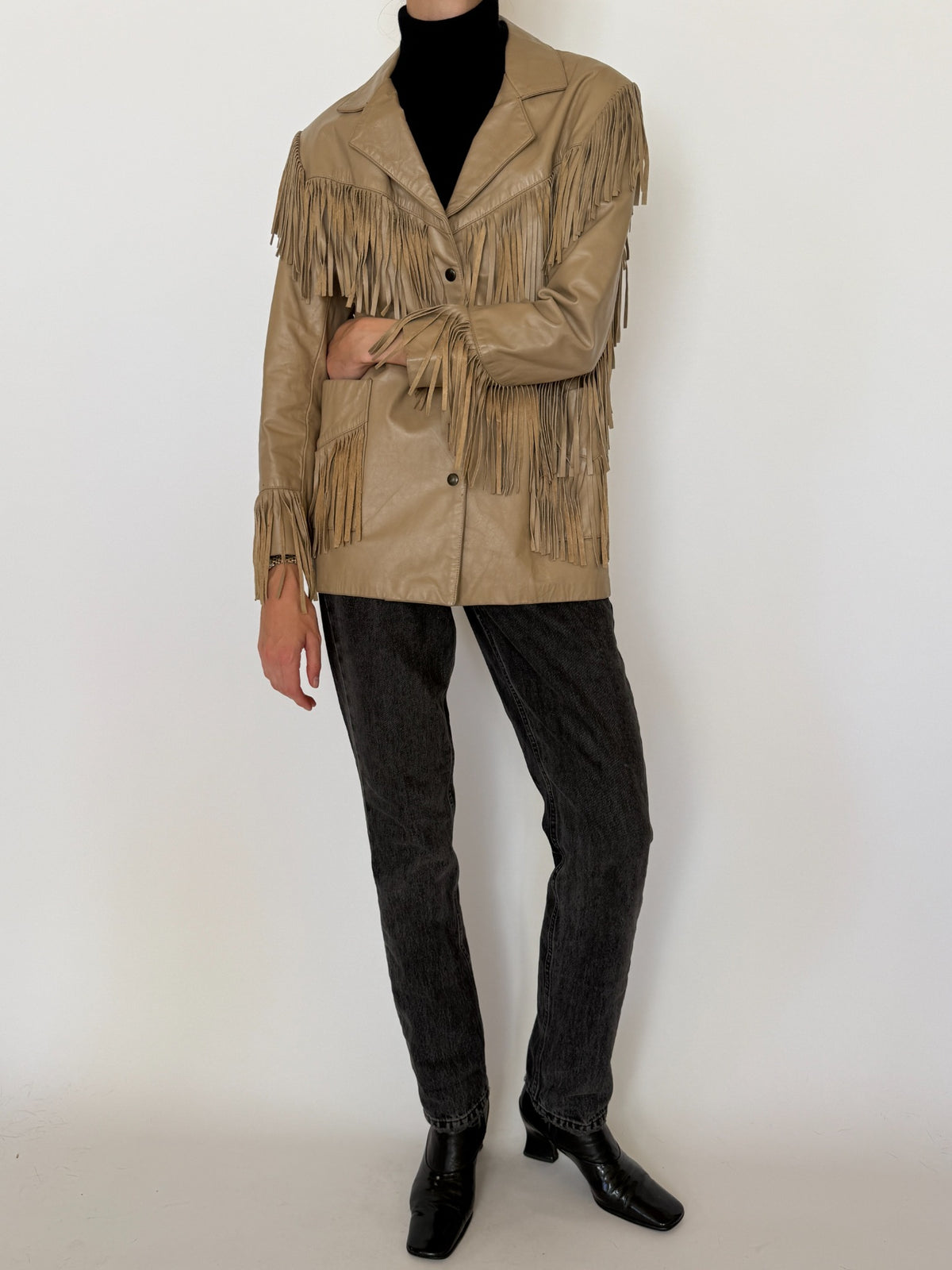 Styled front view of vintage tan leather jacket