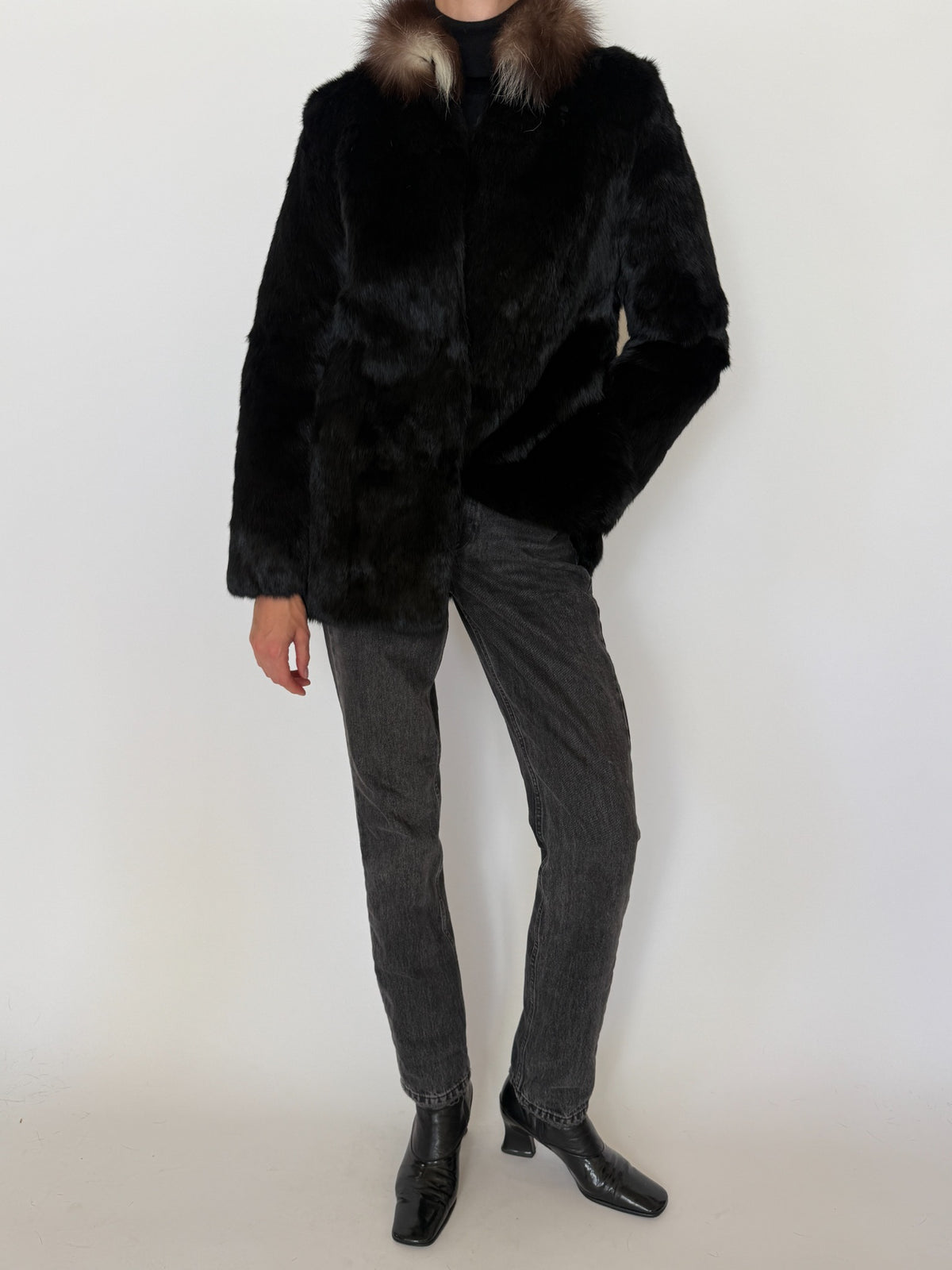 Front view of vintage black rabbit fur jacket with brown and cream collar
