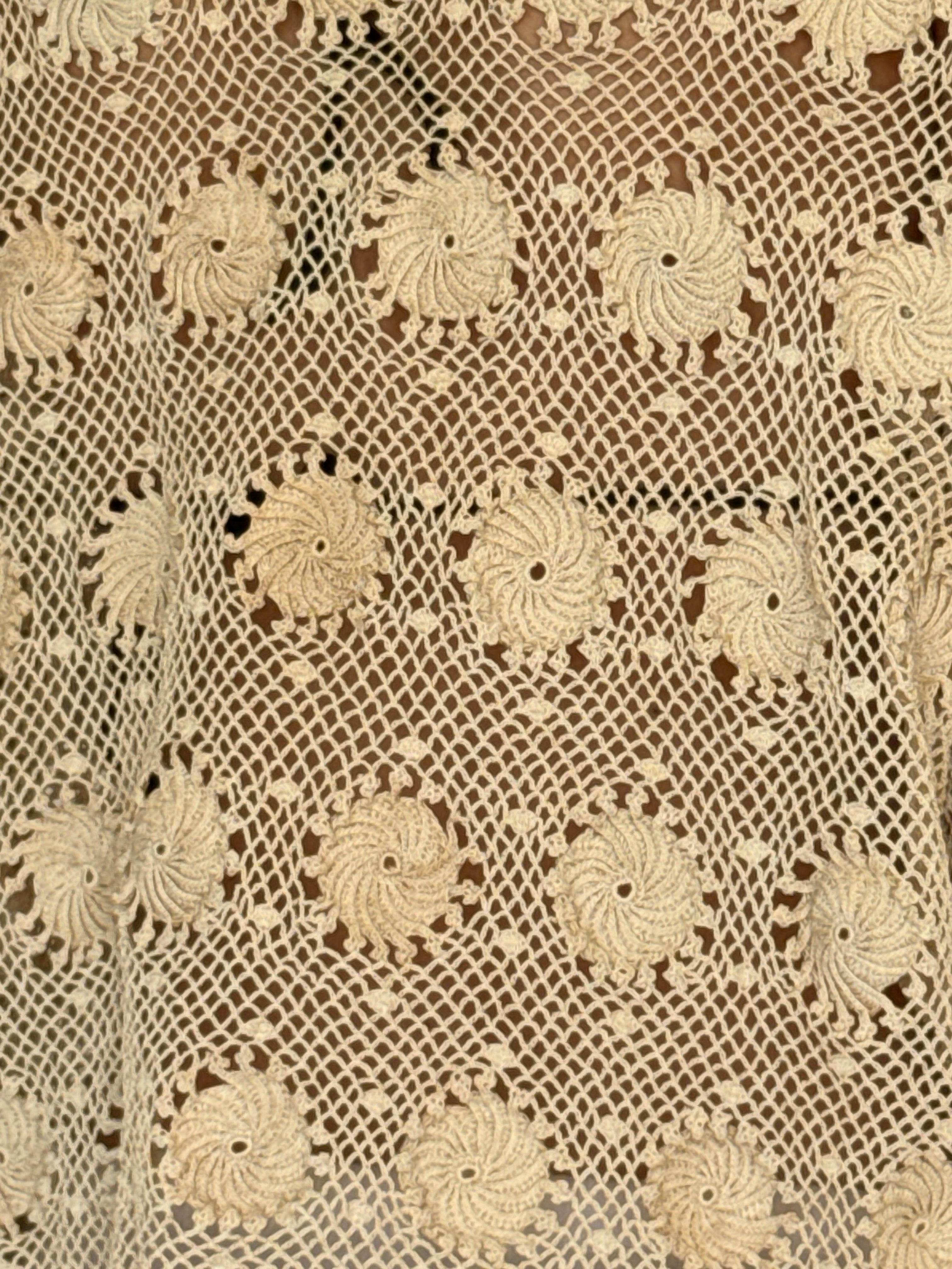 Vintage cream crochet jacket fabric close-up