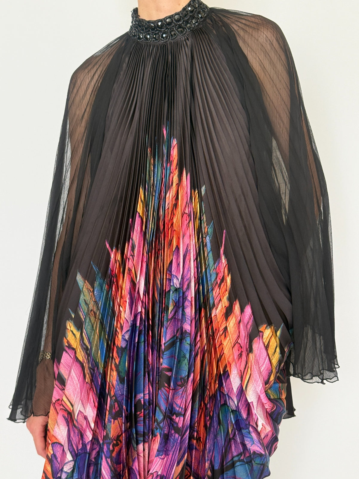 Close-up front view of beaded neckline and pleating