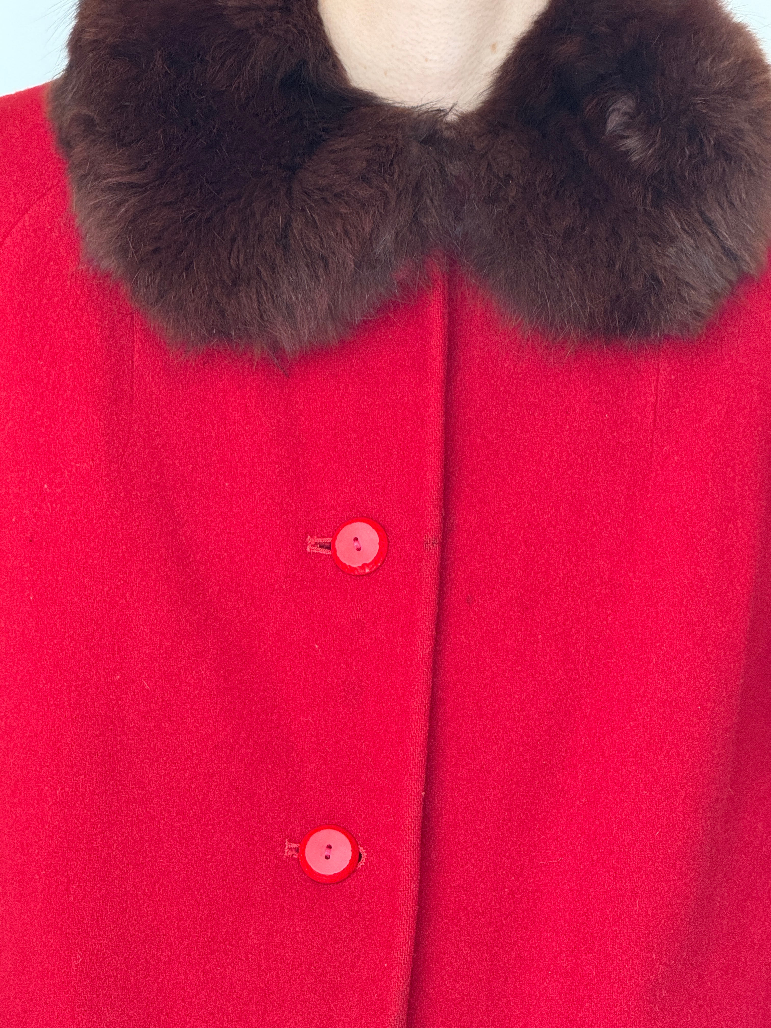 Vintage wool coat featuring plush fur collar in red