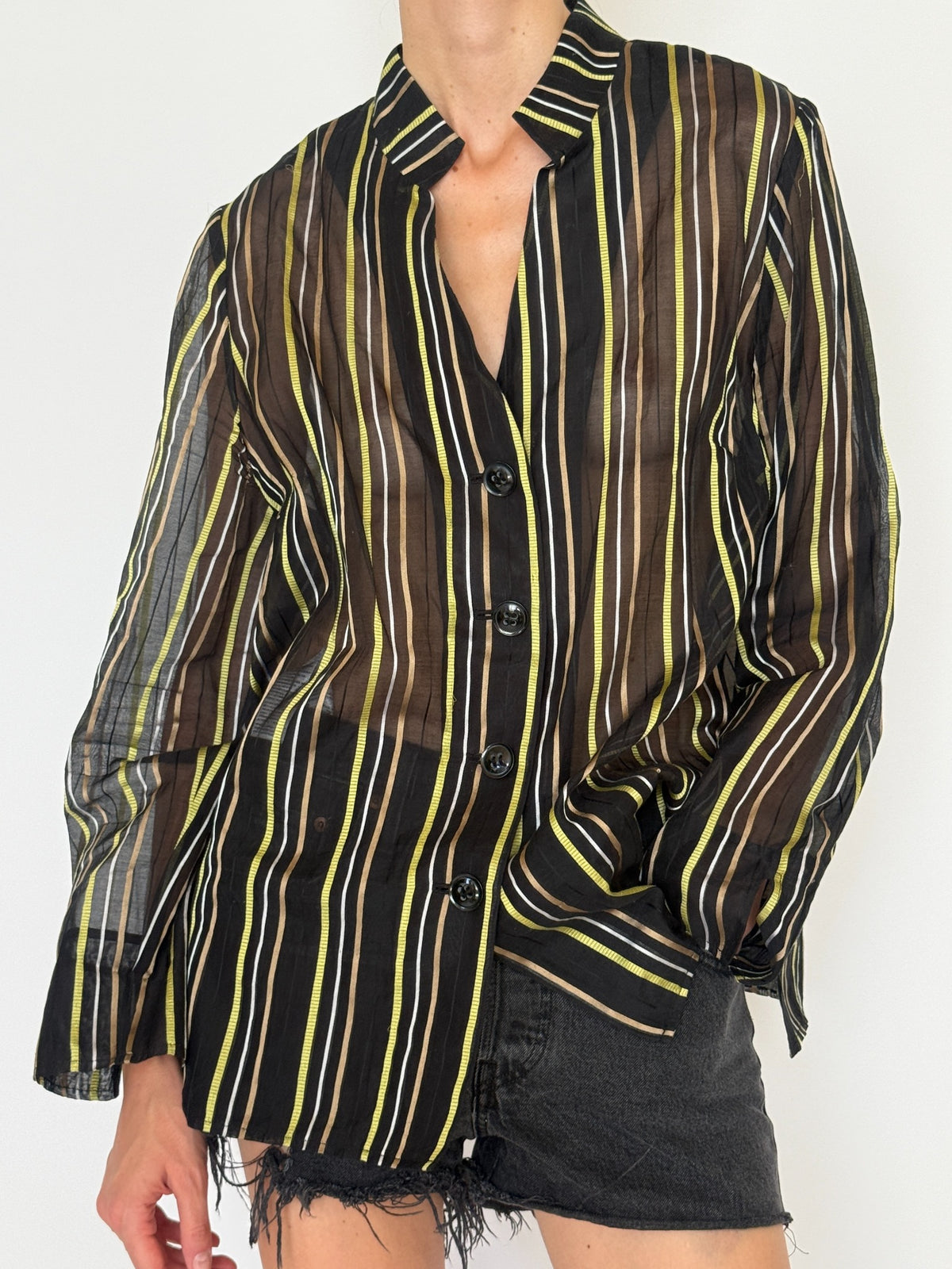 Front buttons of vintage black brown green striped cotton silk shirt