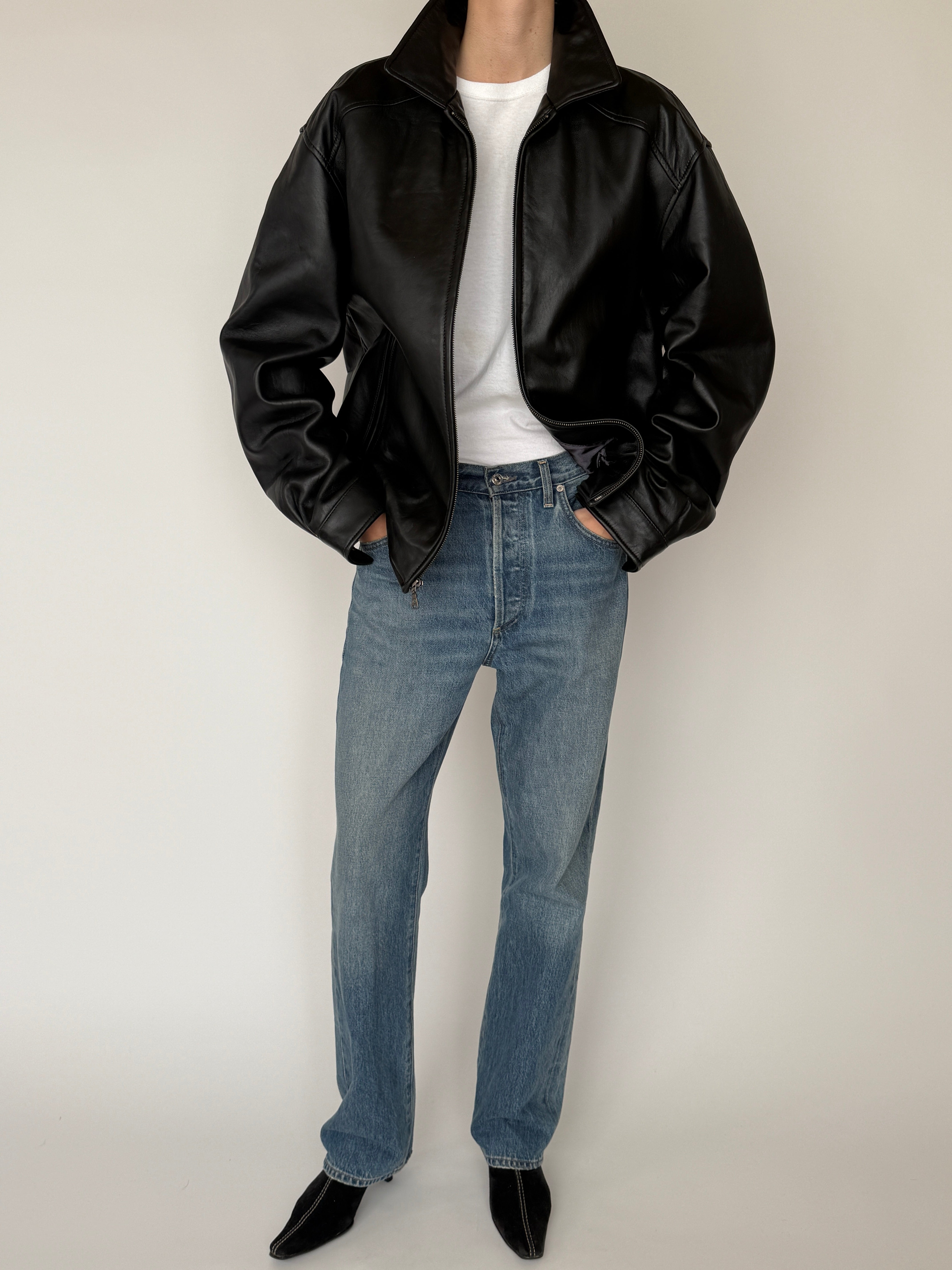 Vintage black leather jacket pocket detail