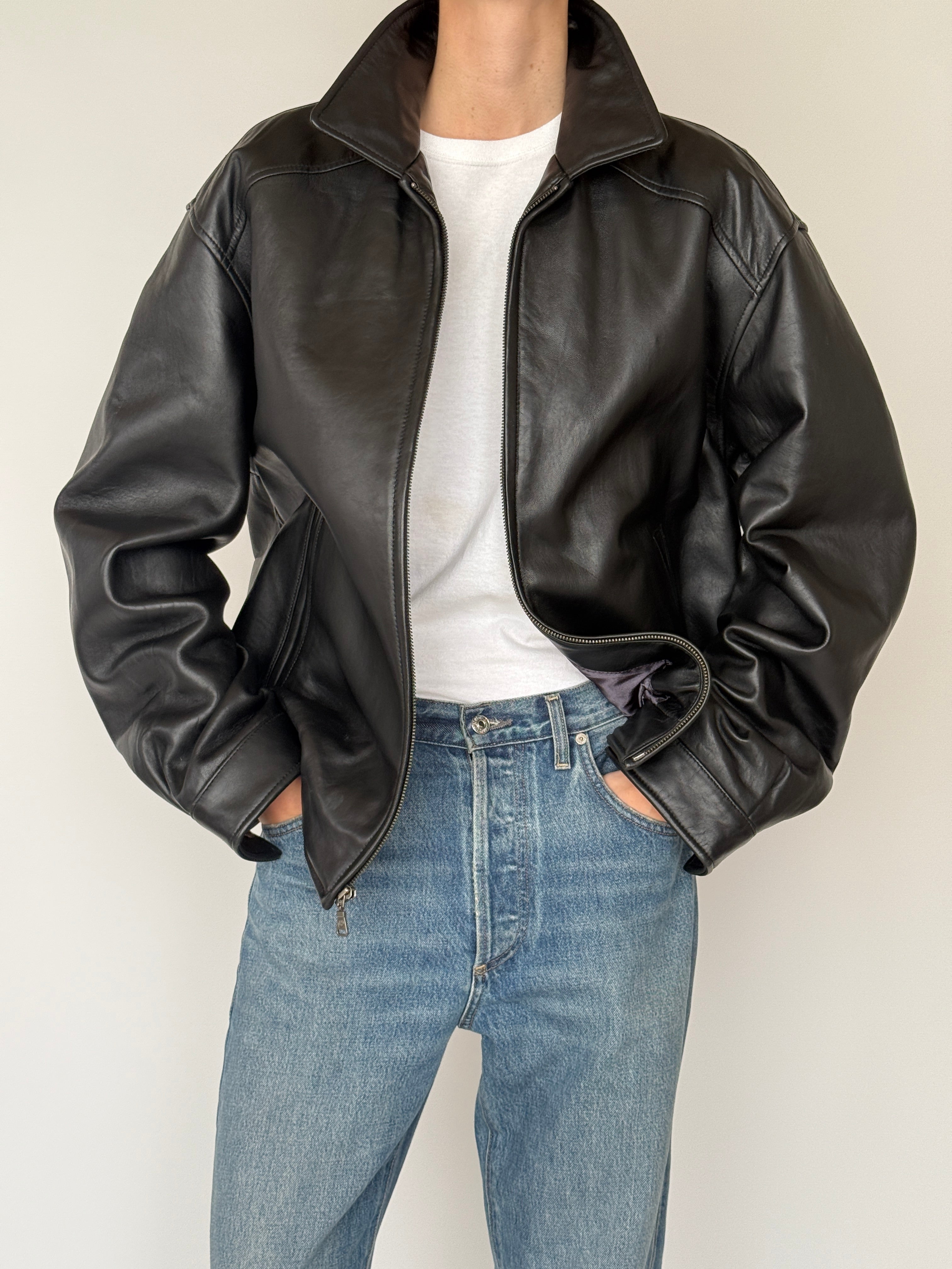 Vintage black leather jacket leather texture close-up