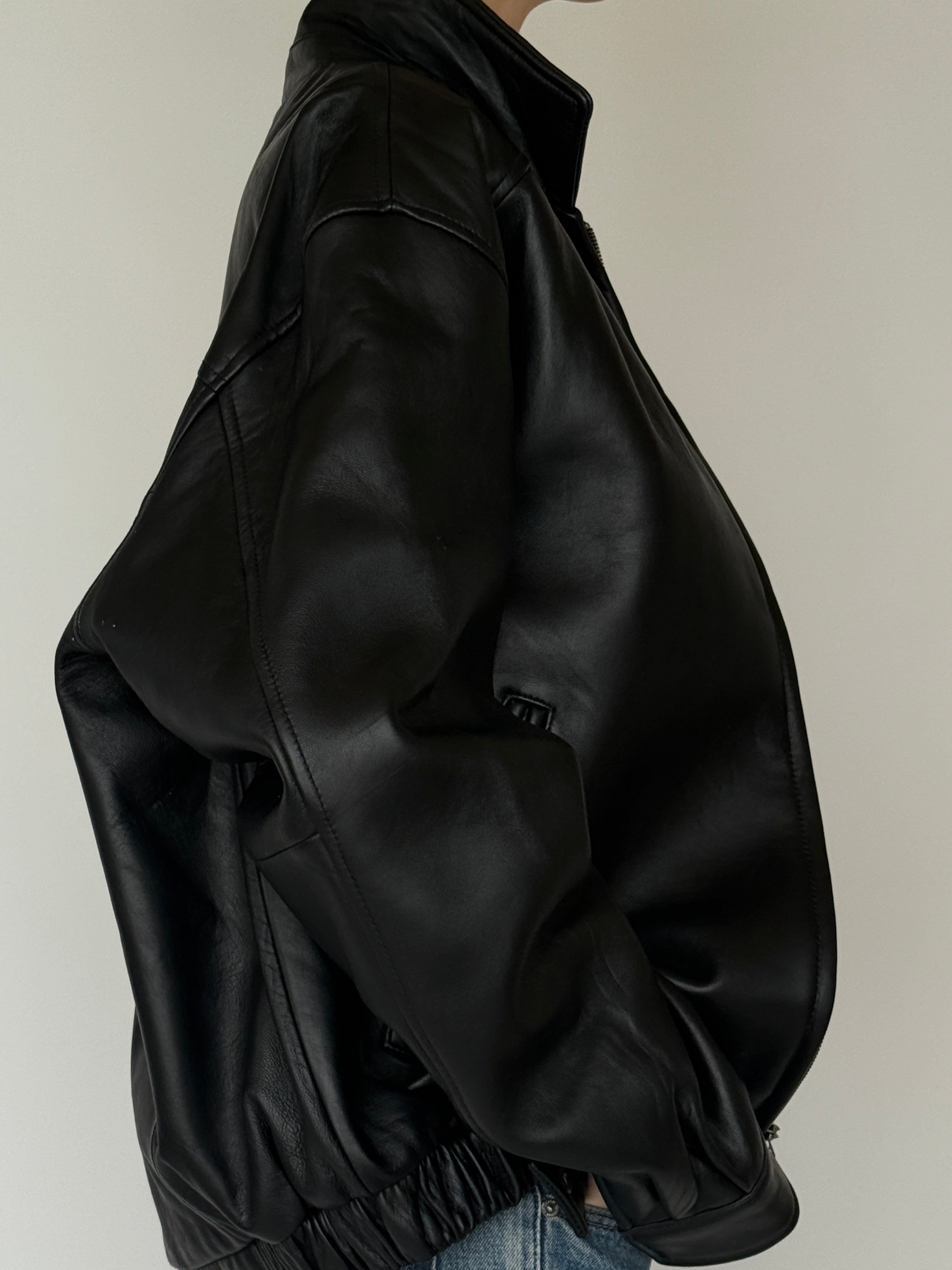 Vintage black leather jacket side view