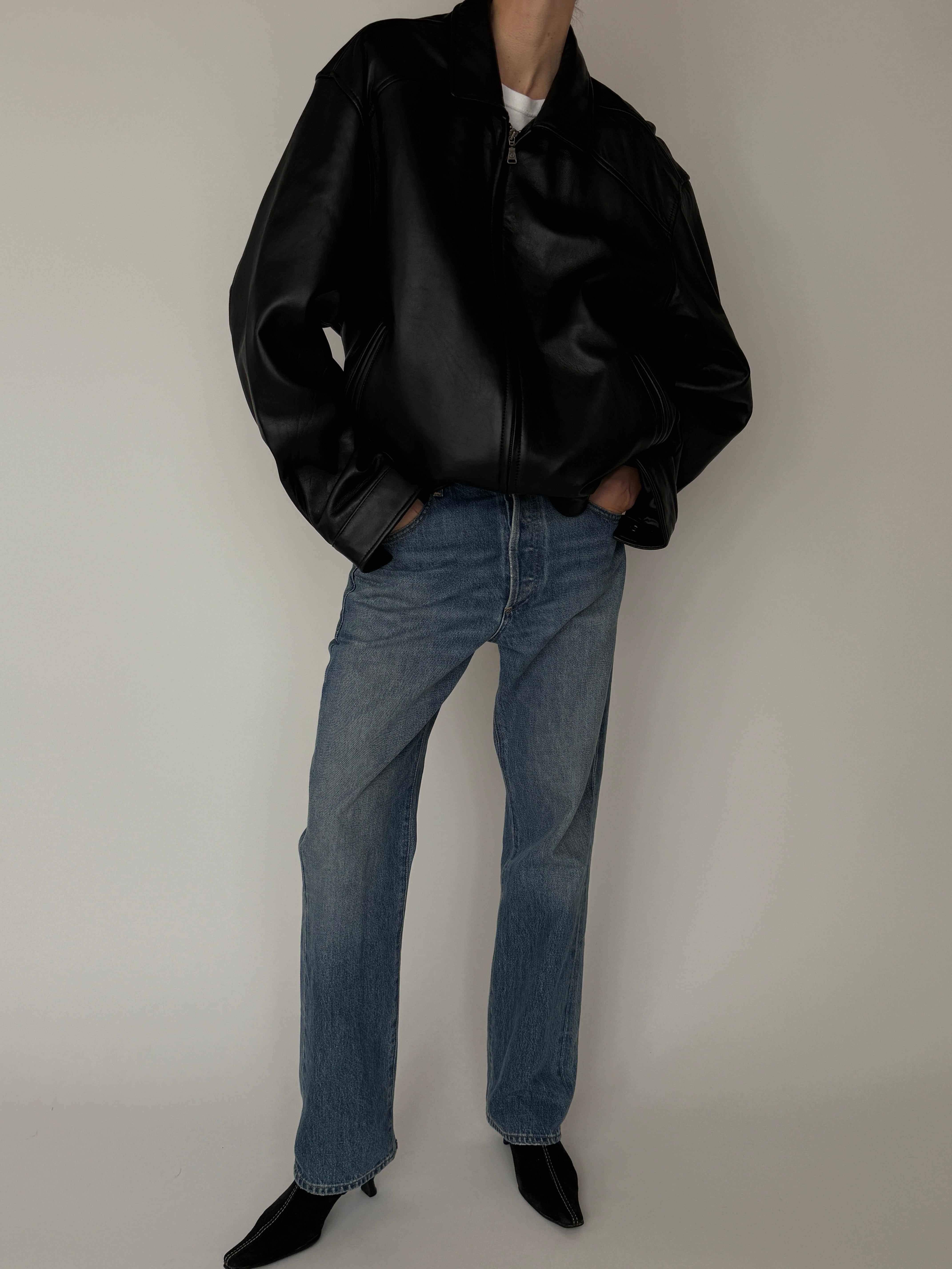Vintage black leather jacket pocket detail