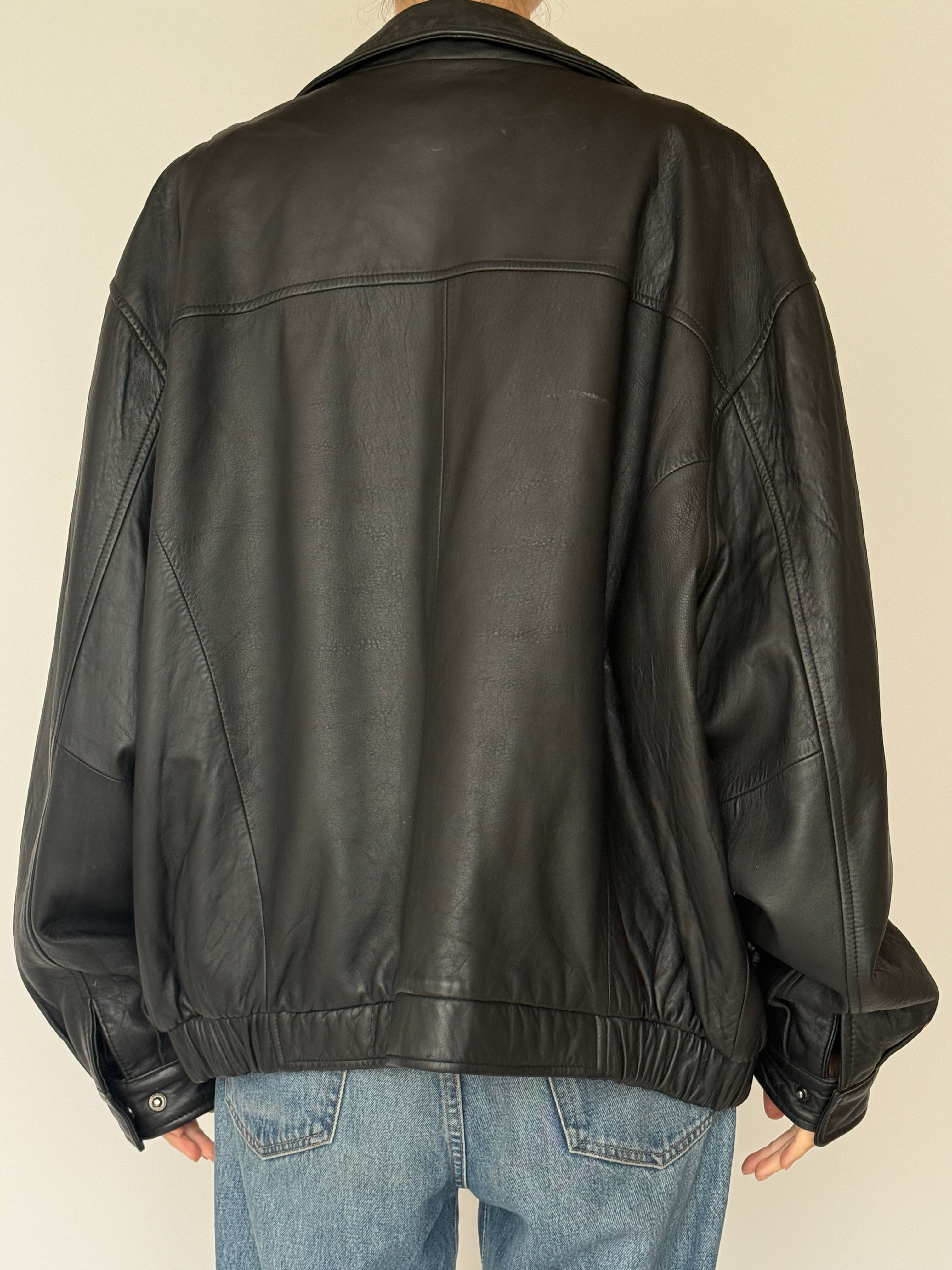 Vintage black leather zip jacket back view
