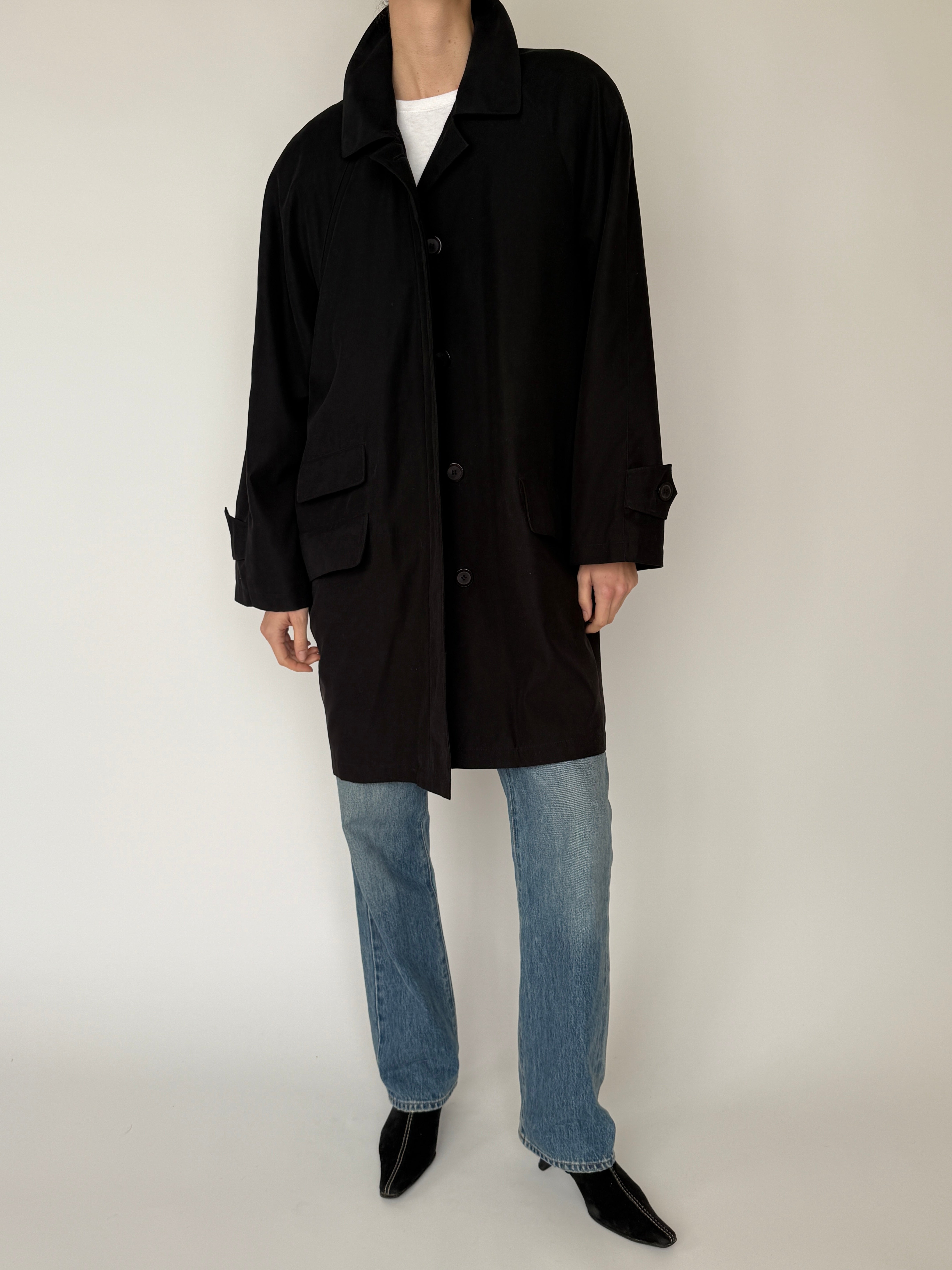 Vintage black oversized coat button closure detail