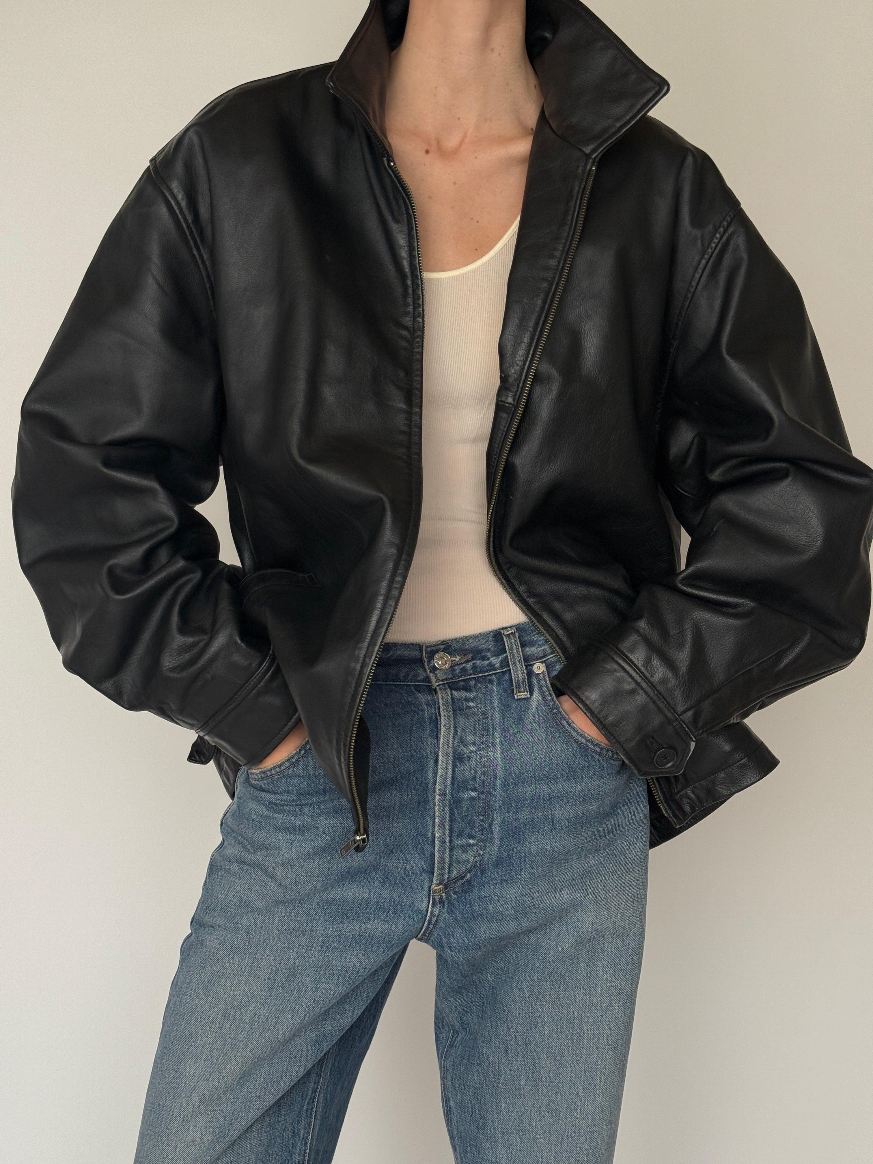 Vintage black leather jacket with stand collar and relaxed silhouette