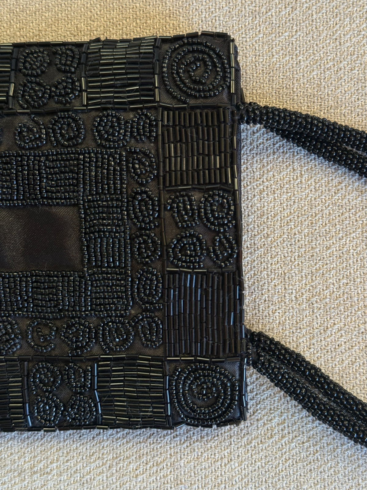 Detail of black seed beads and bugle beads on mini bag
