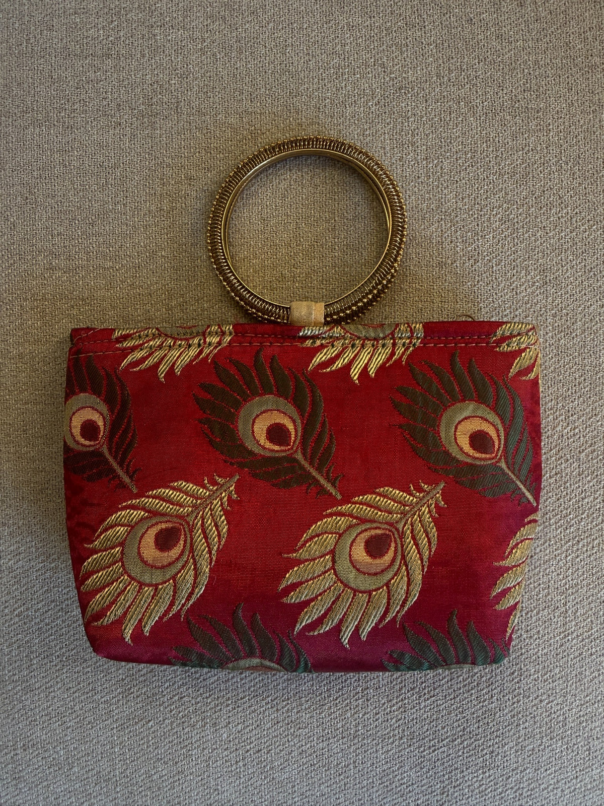 Back of burgundy peacock feather brocade handbag