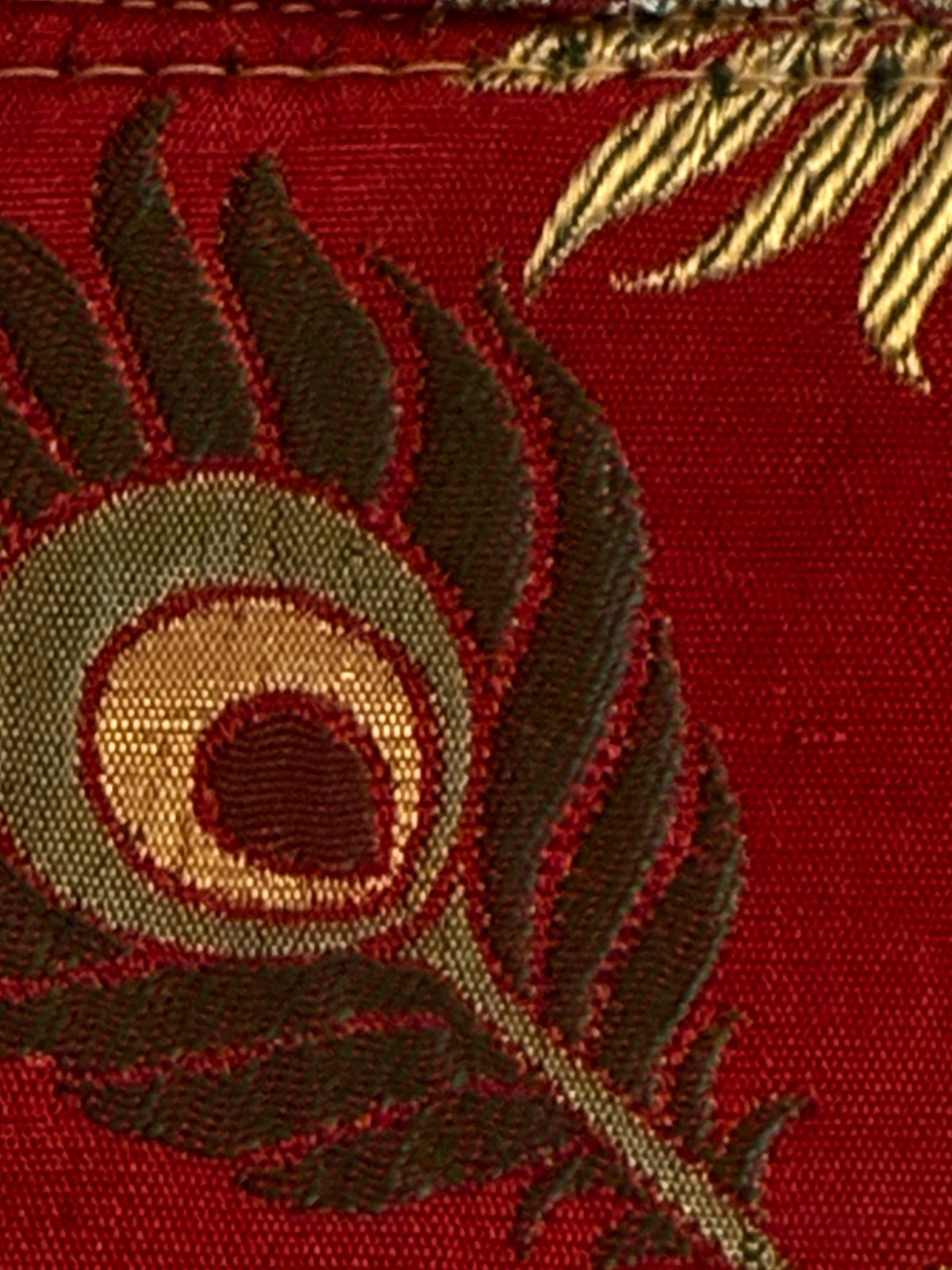 Close up of peacock feather motif woven fabric