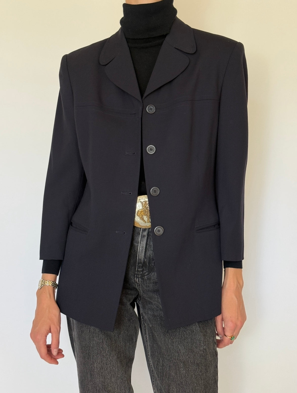 Front view of navy blazer welt pockets