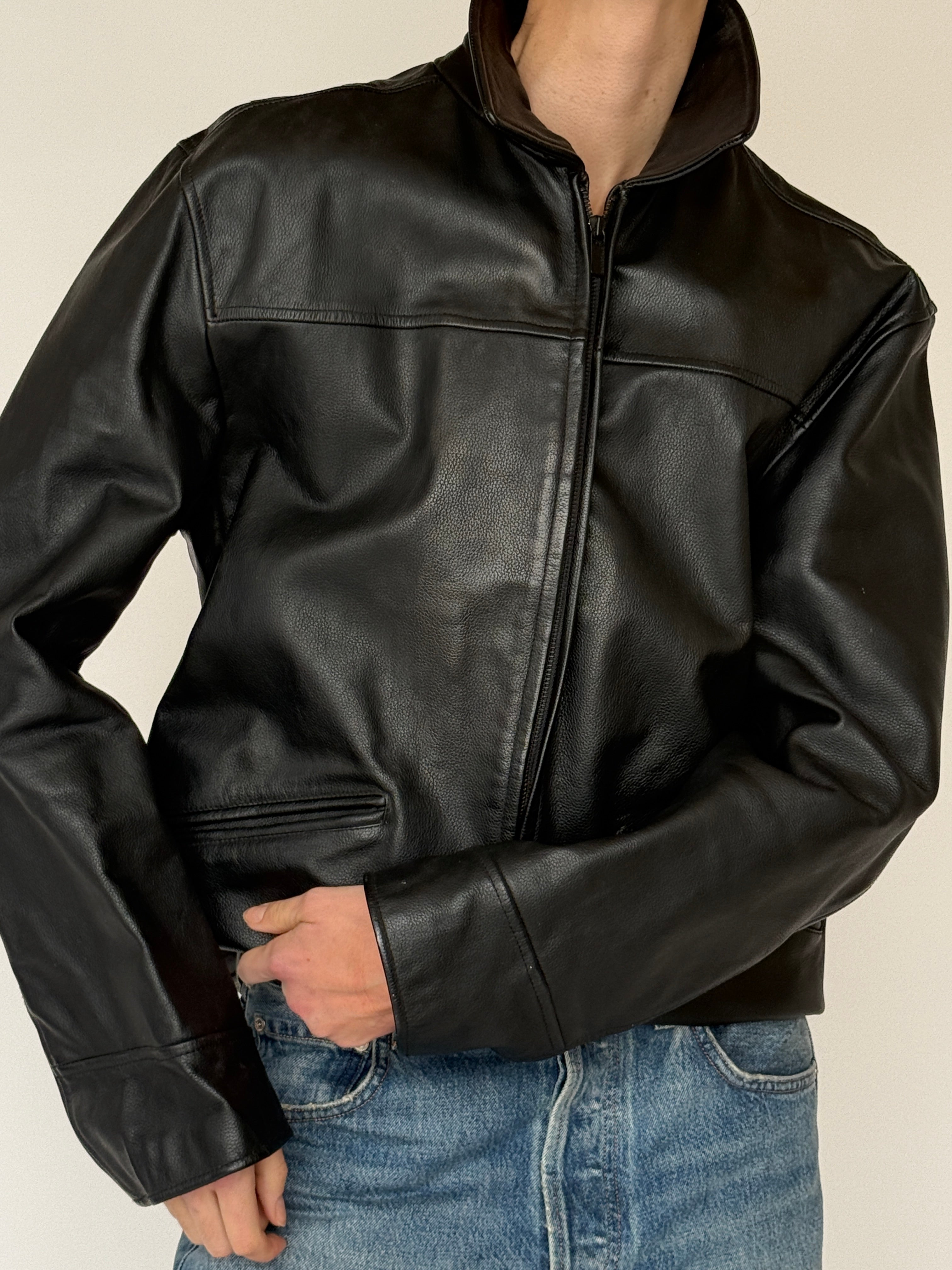 Vintage black leather jacket leather texture detail