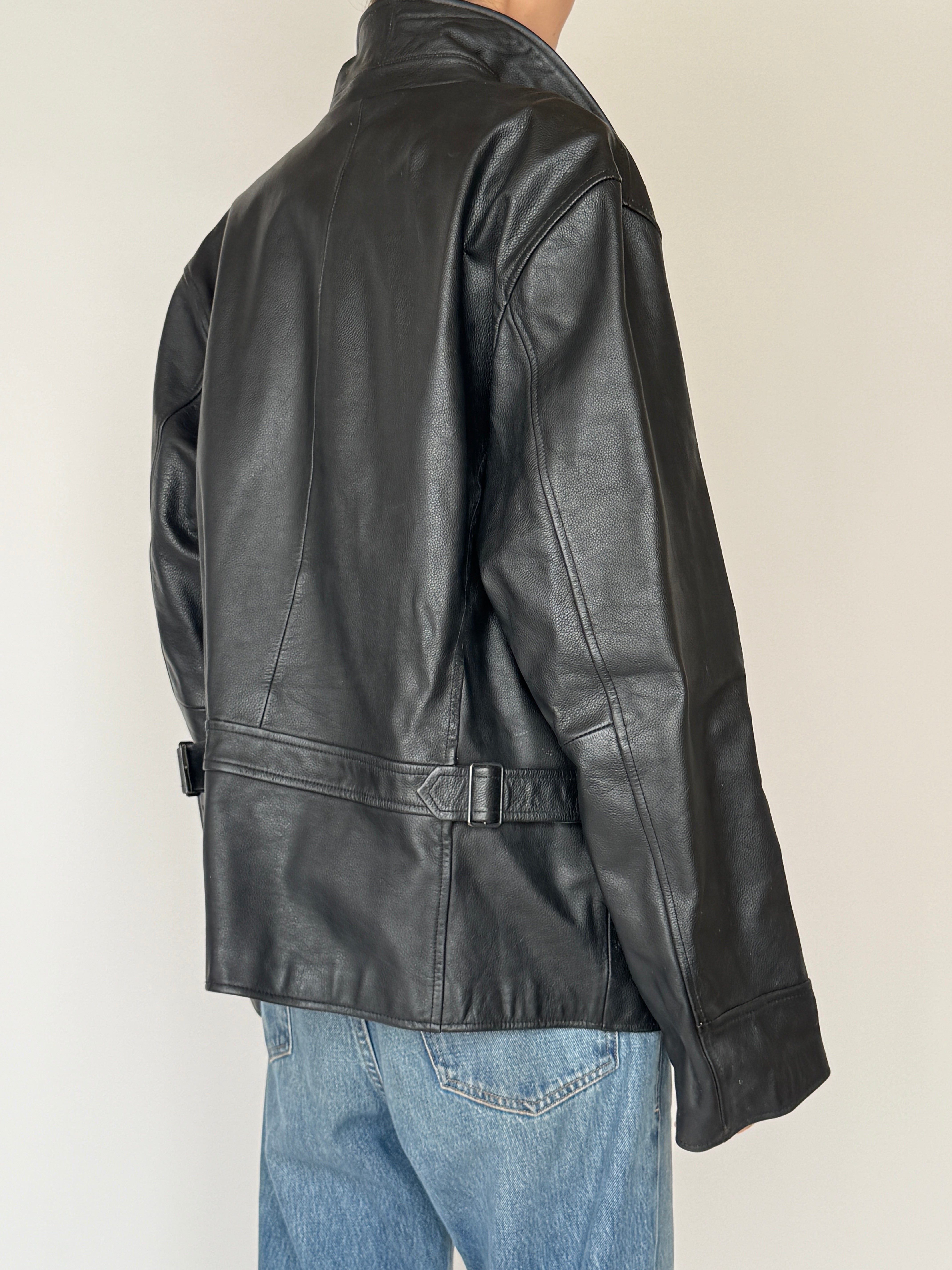 Vintage black leather jacket back view close-up