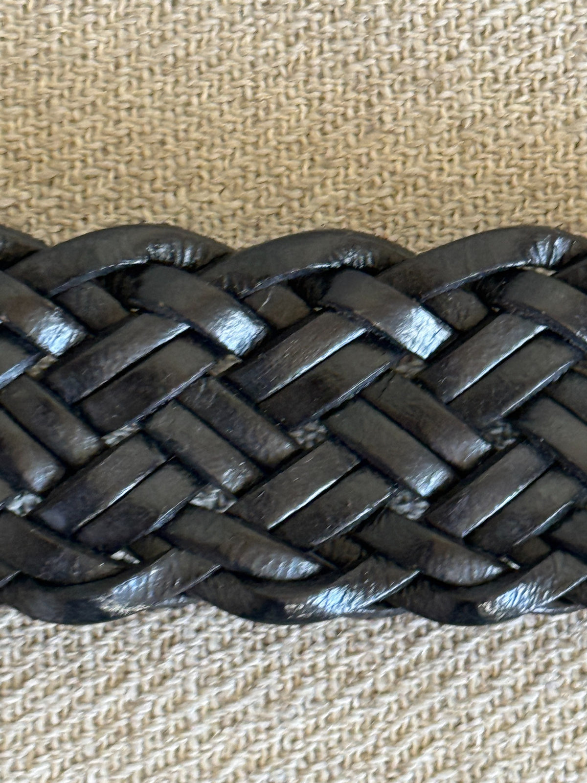 Close-up of woven black leather braid