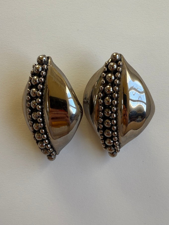 Sculptural leaf-like silver-tone vintage earring