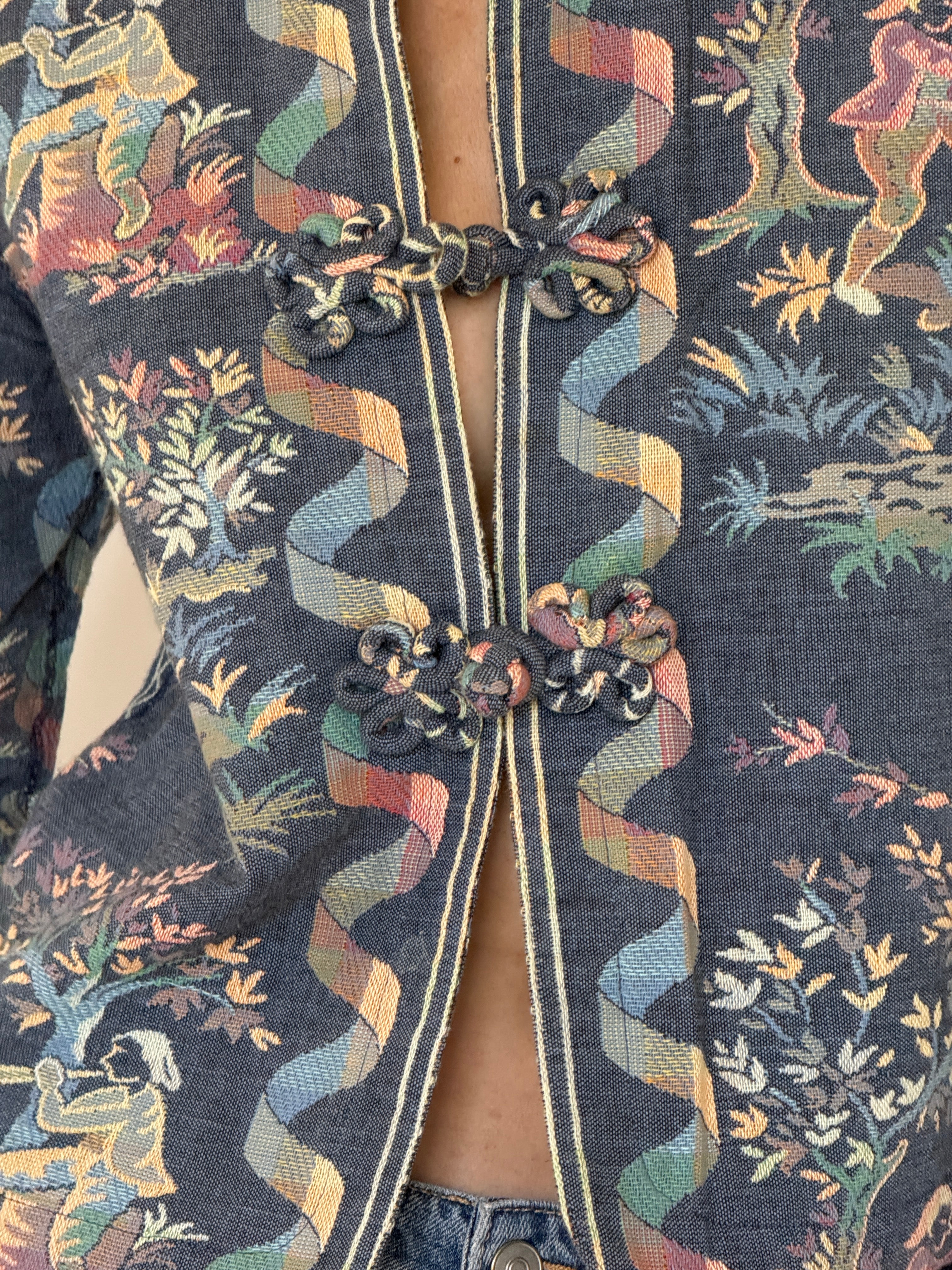 Vintage blue tapestry jacket woven fabric close-up