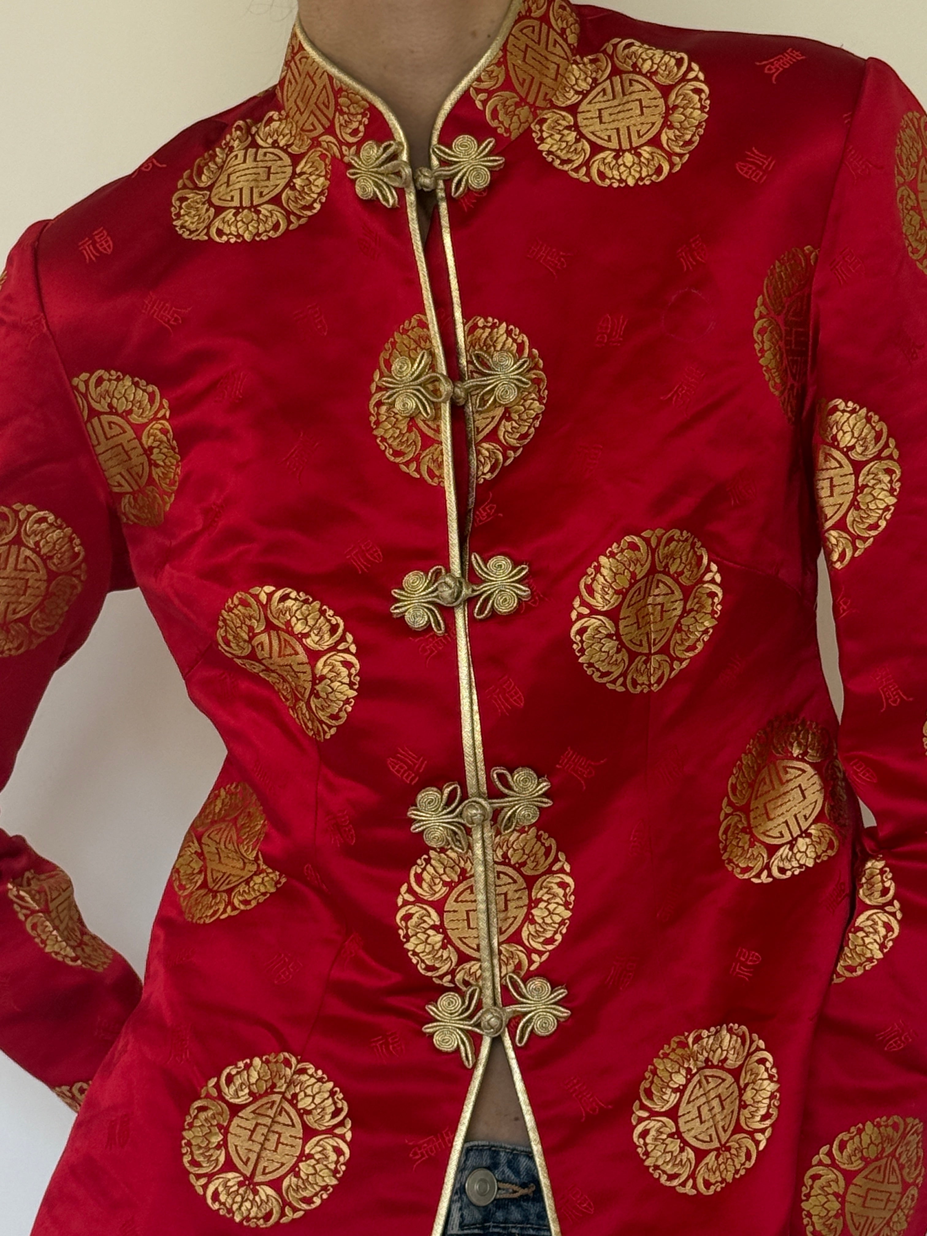 Vintage red and gold brocade fabric close-up