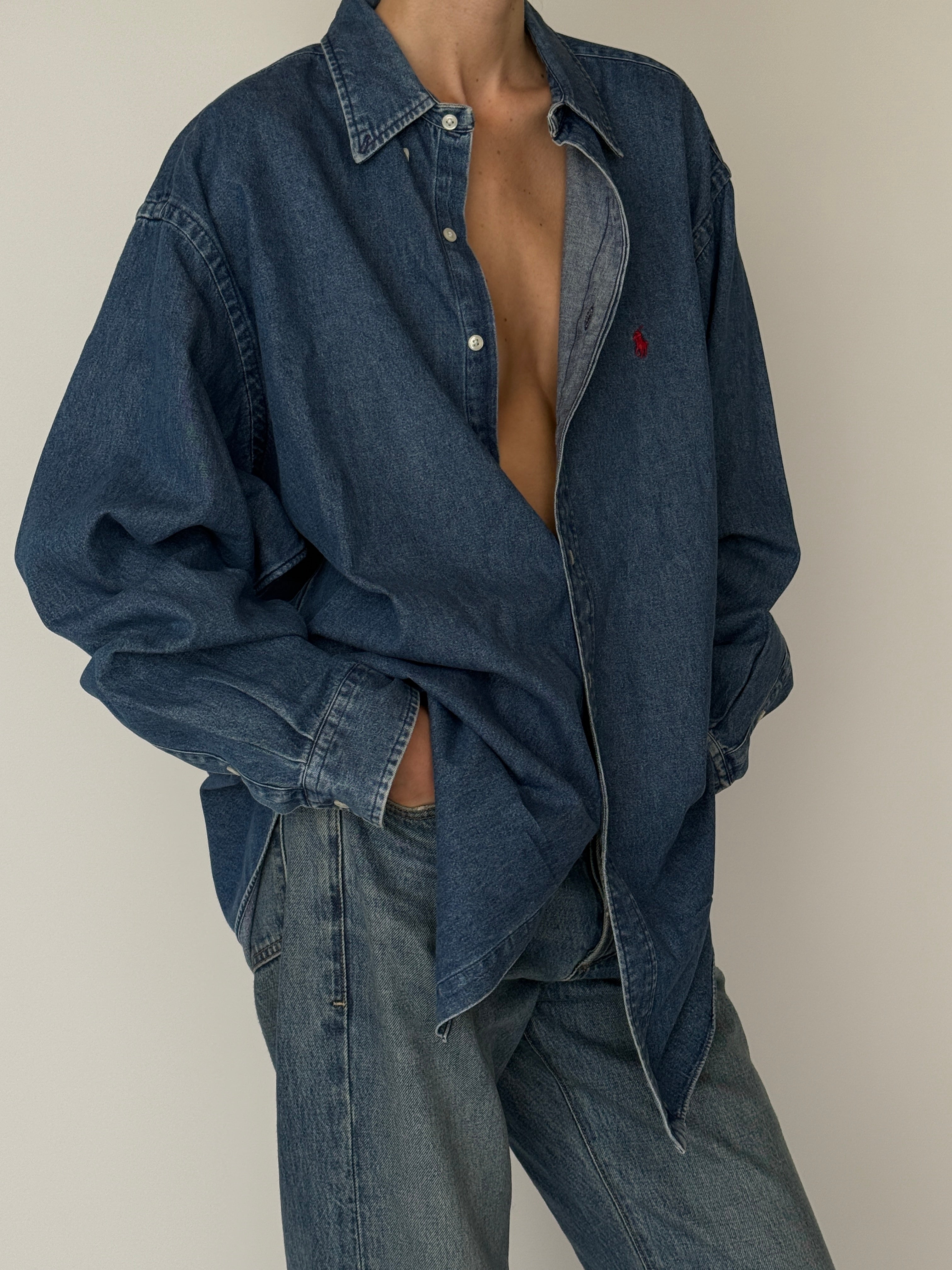 Vintage long sleeve denim shirt featuring button-front closure in blue side view