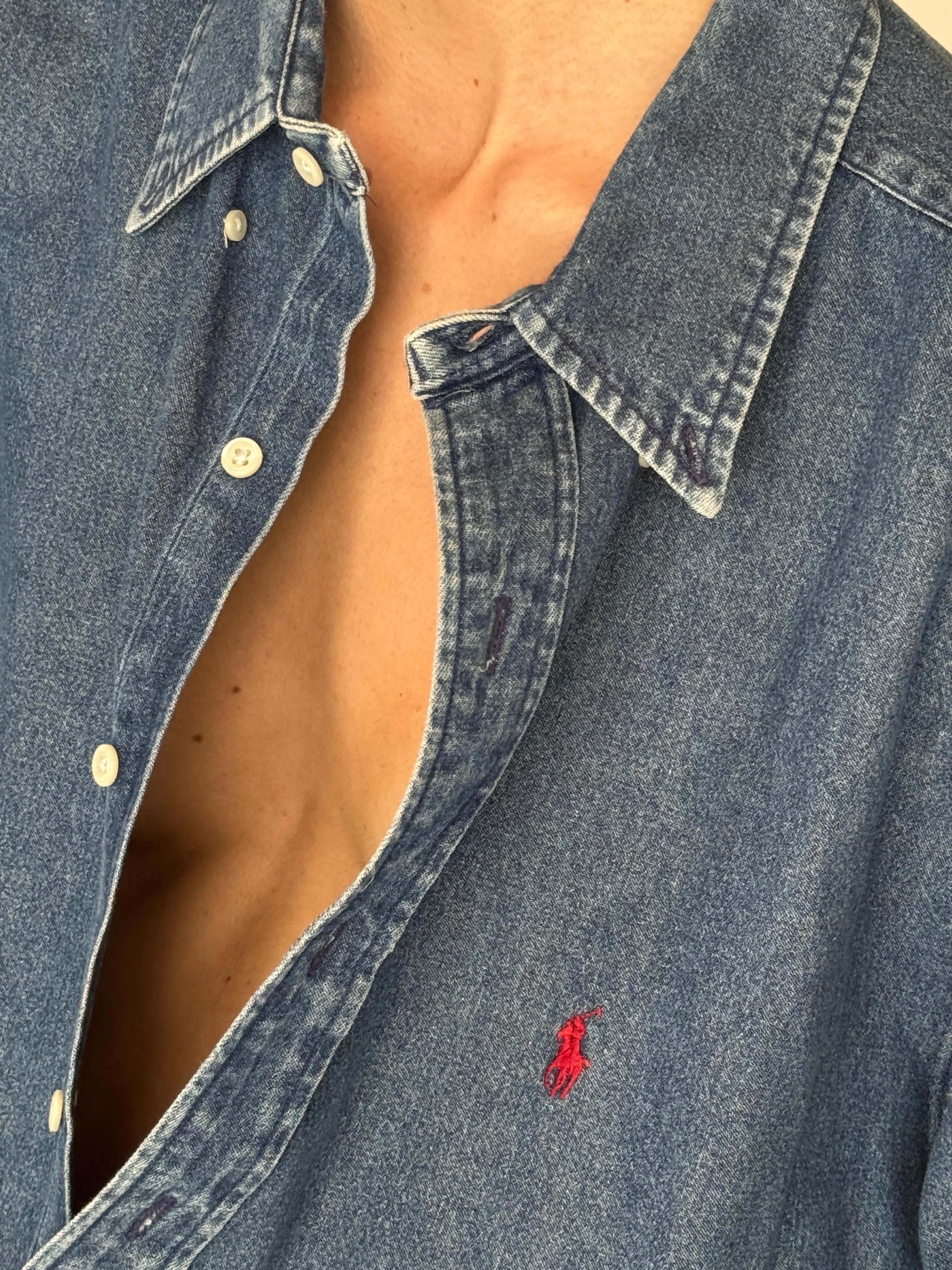 Vintage classic denim button-down with soft washed finish in blue logo detail