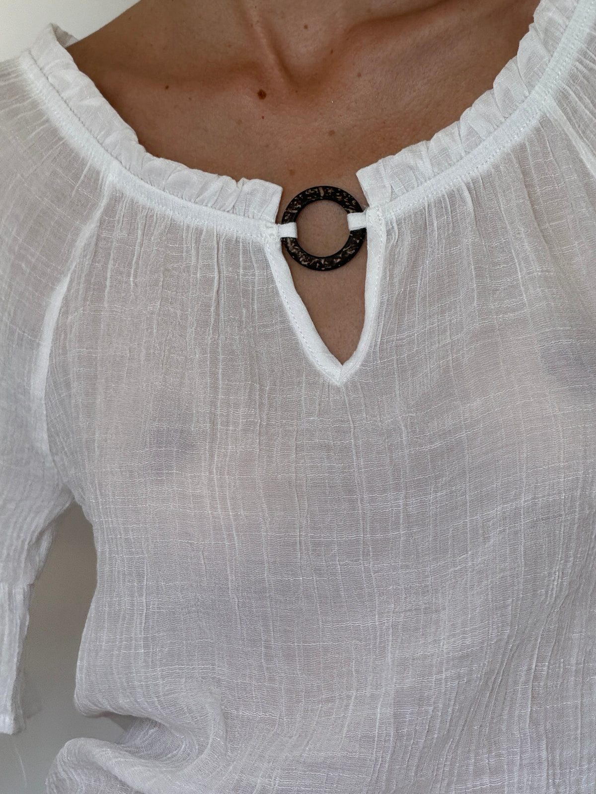 Vintage white blouse textured fabric close-up