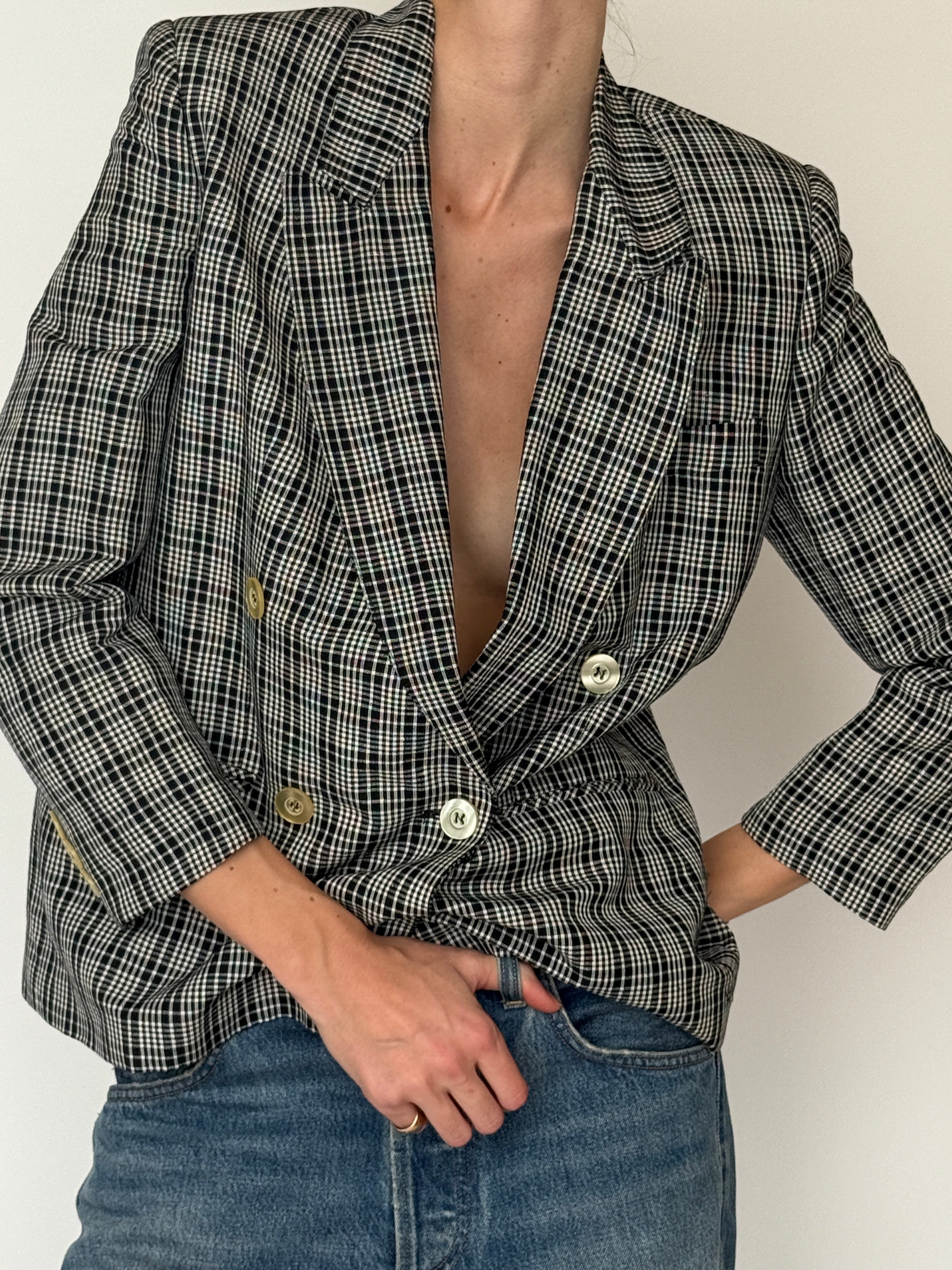 Vintage black ivory plaid blazer fabric close-up check pattern