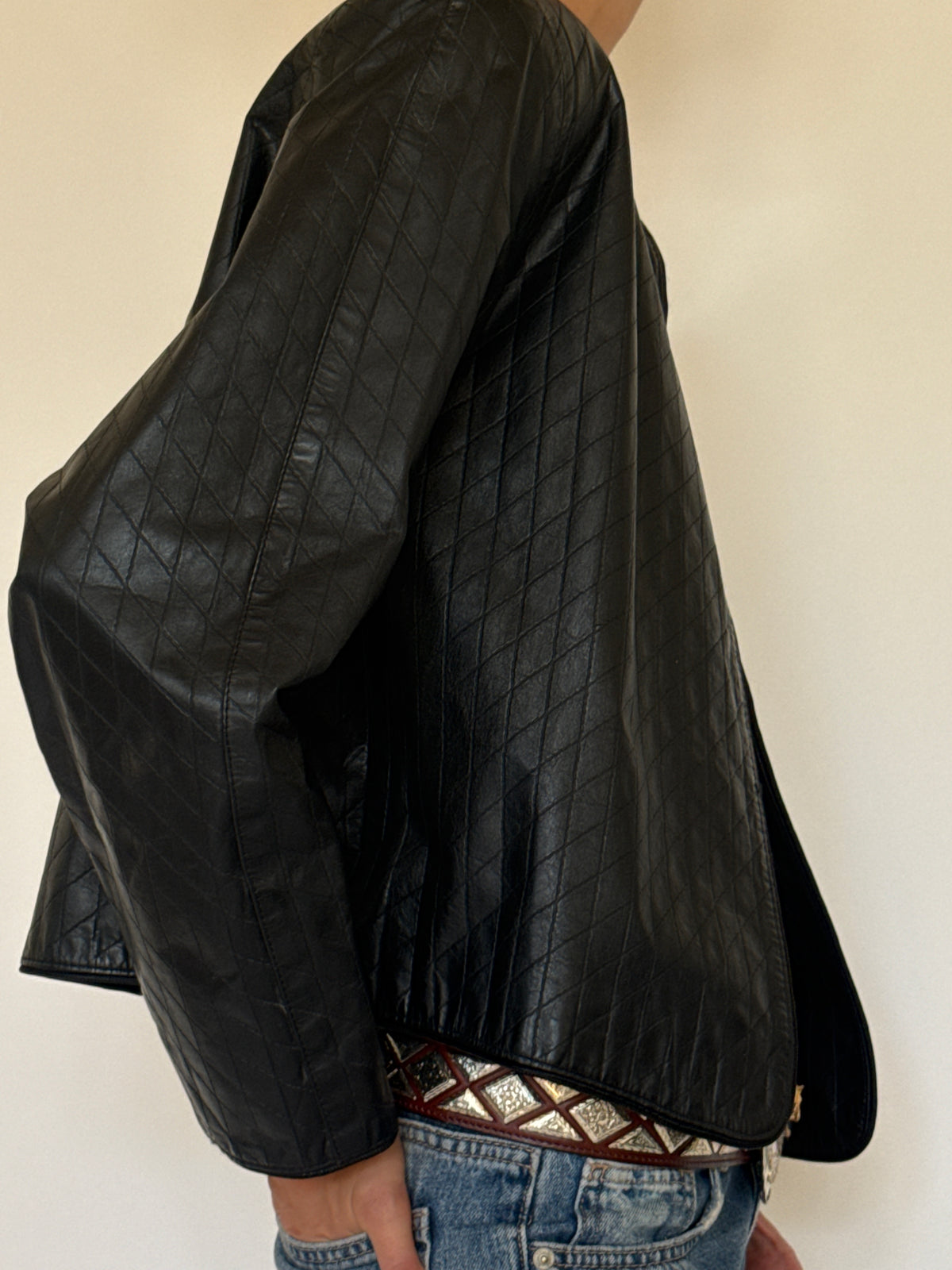 Vintage black quilted leather jacket side view