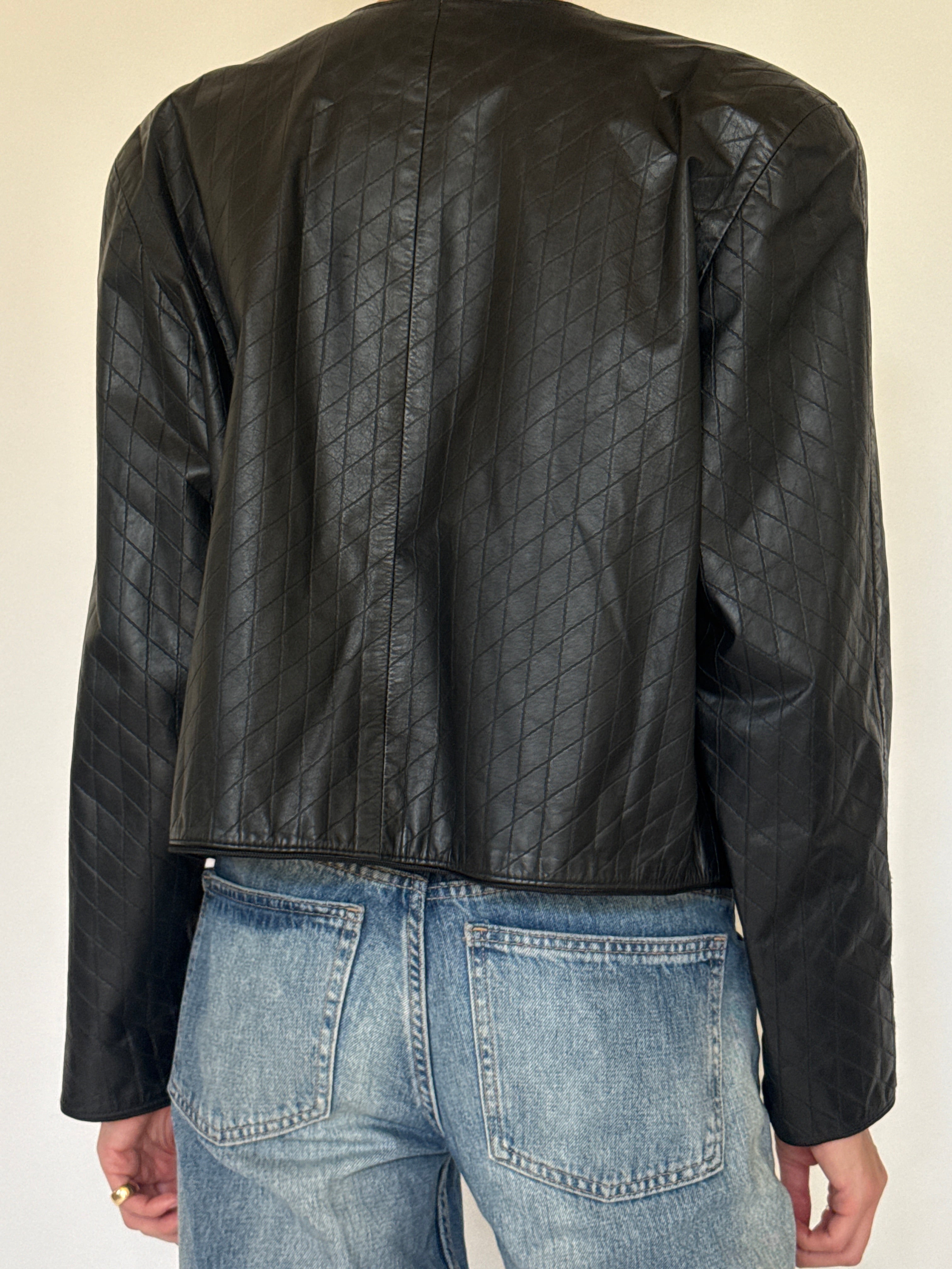 Vintage black quilted leather jacket back view