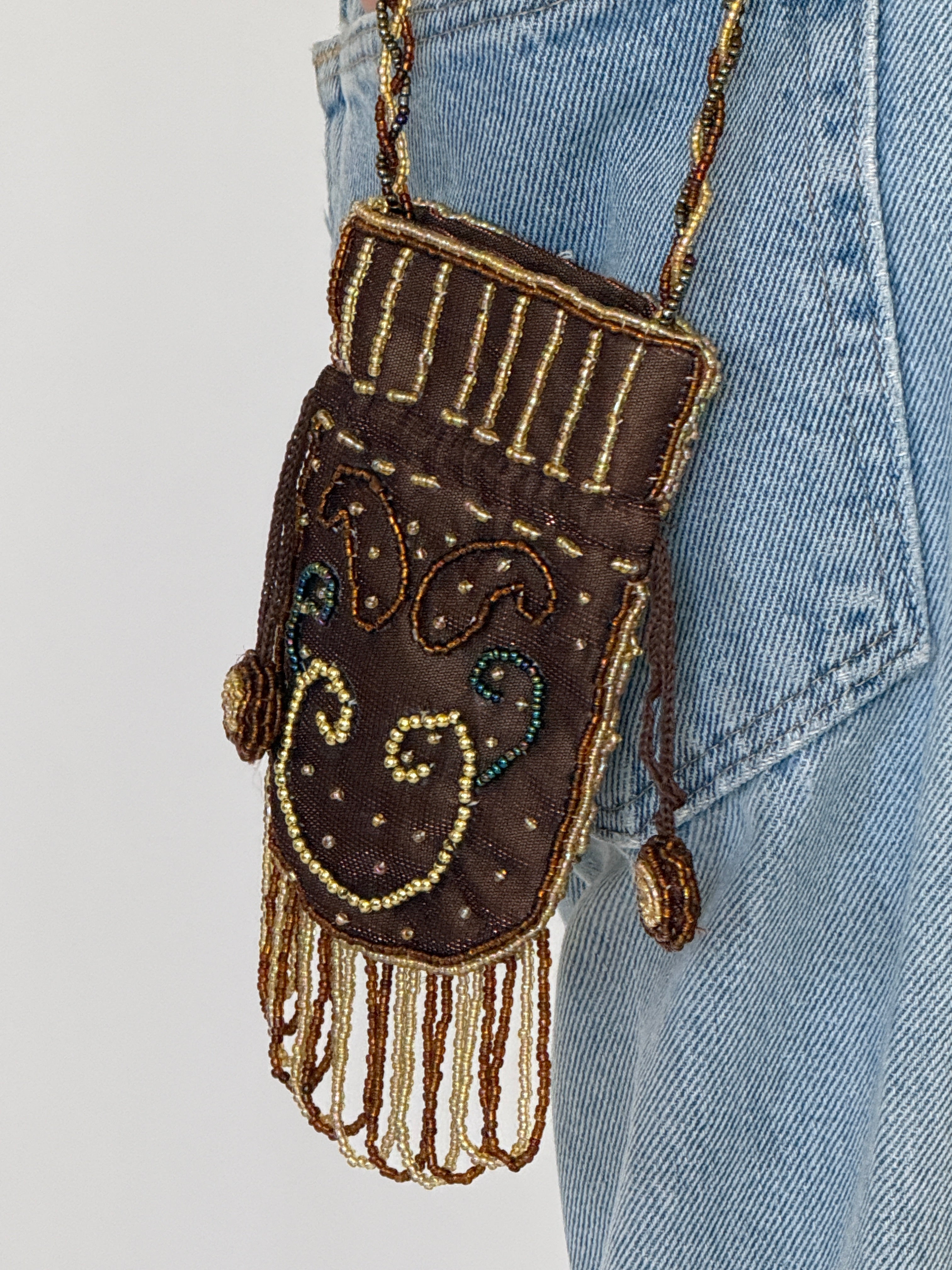 Vintage brown potli bag beadwork close-up