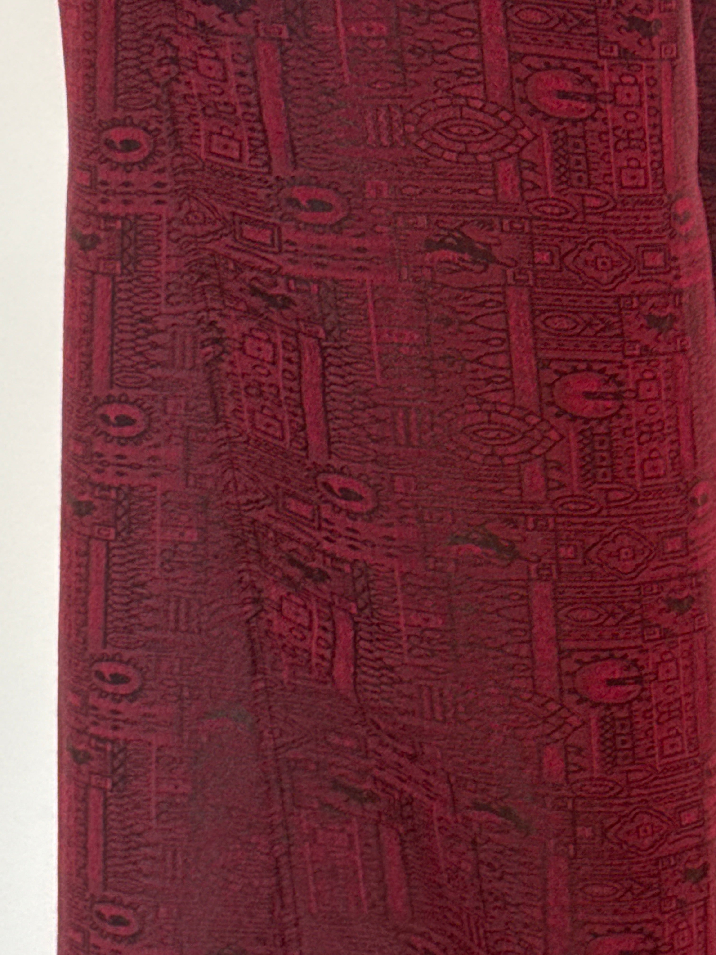 Vintage burgundy pants fabric close-up