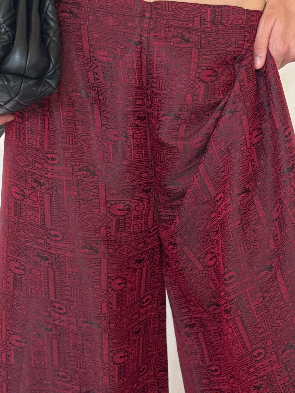 Vintage burgundy pants fabric close-up