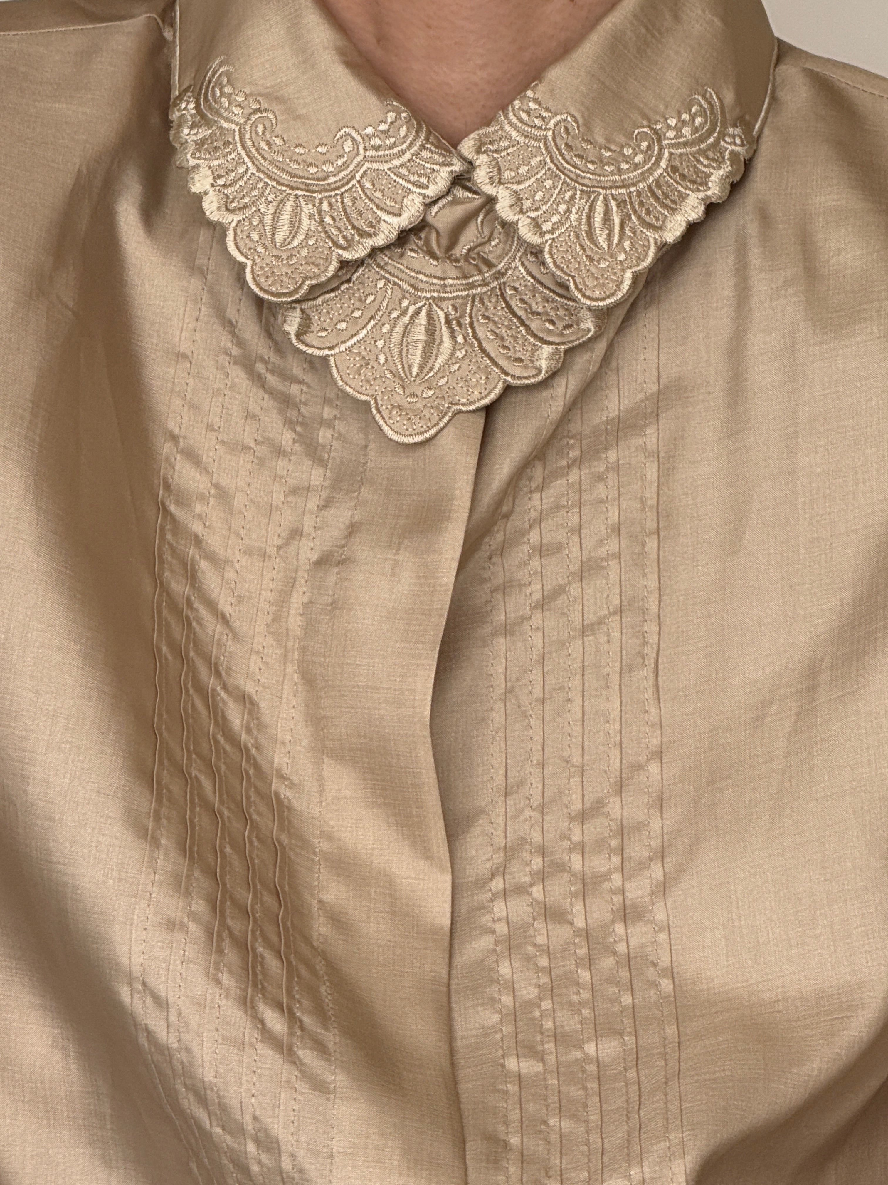 Vintage champagne embroidered collar blouse fabric close-up subtle sheen texture
