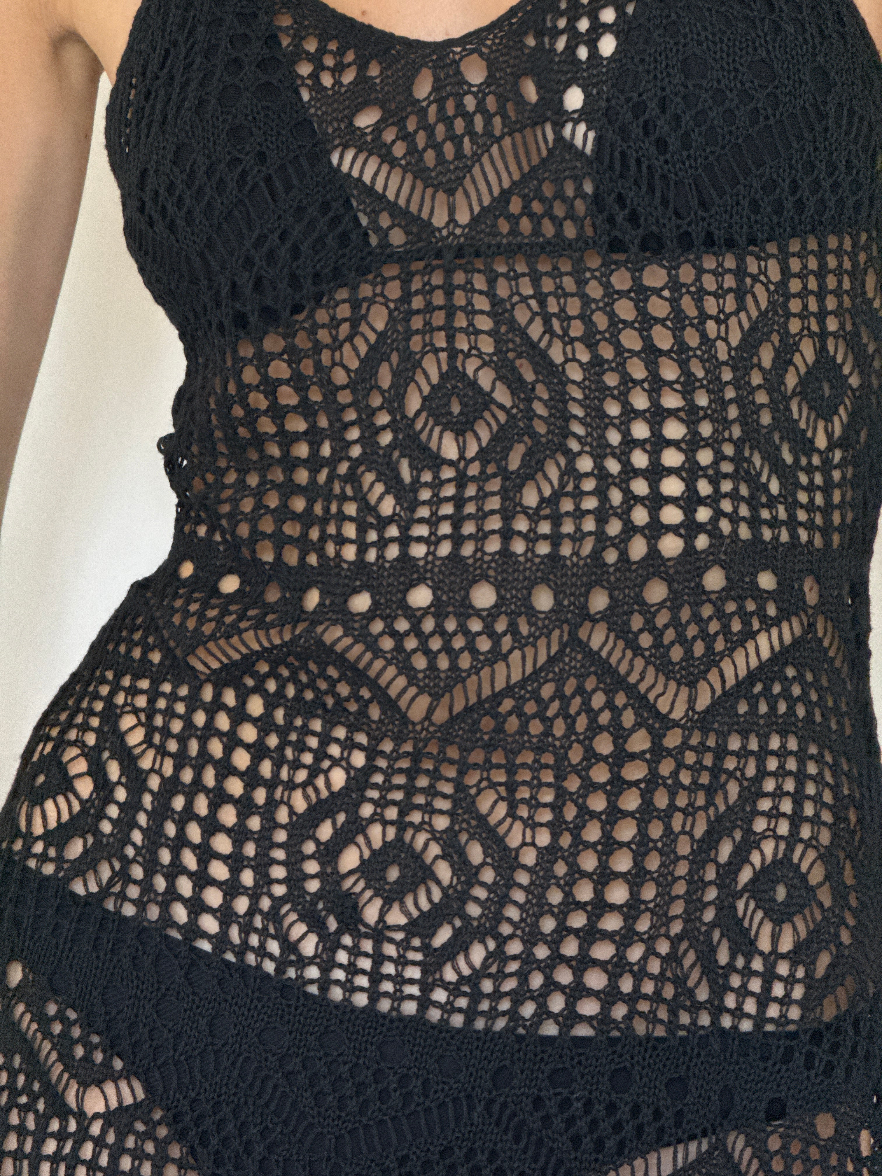 Vintage black crochet openwork fabric close-up