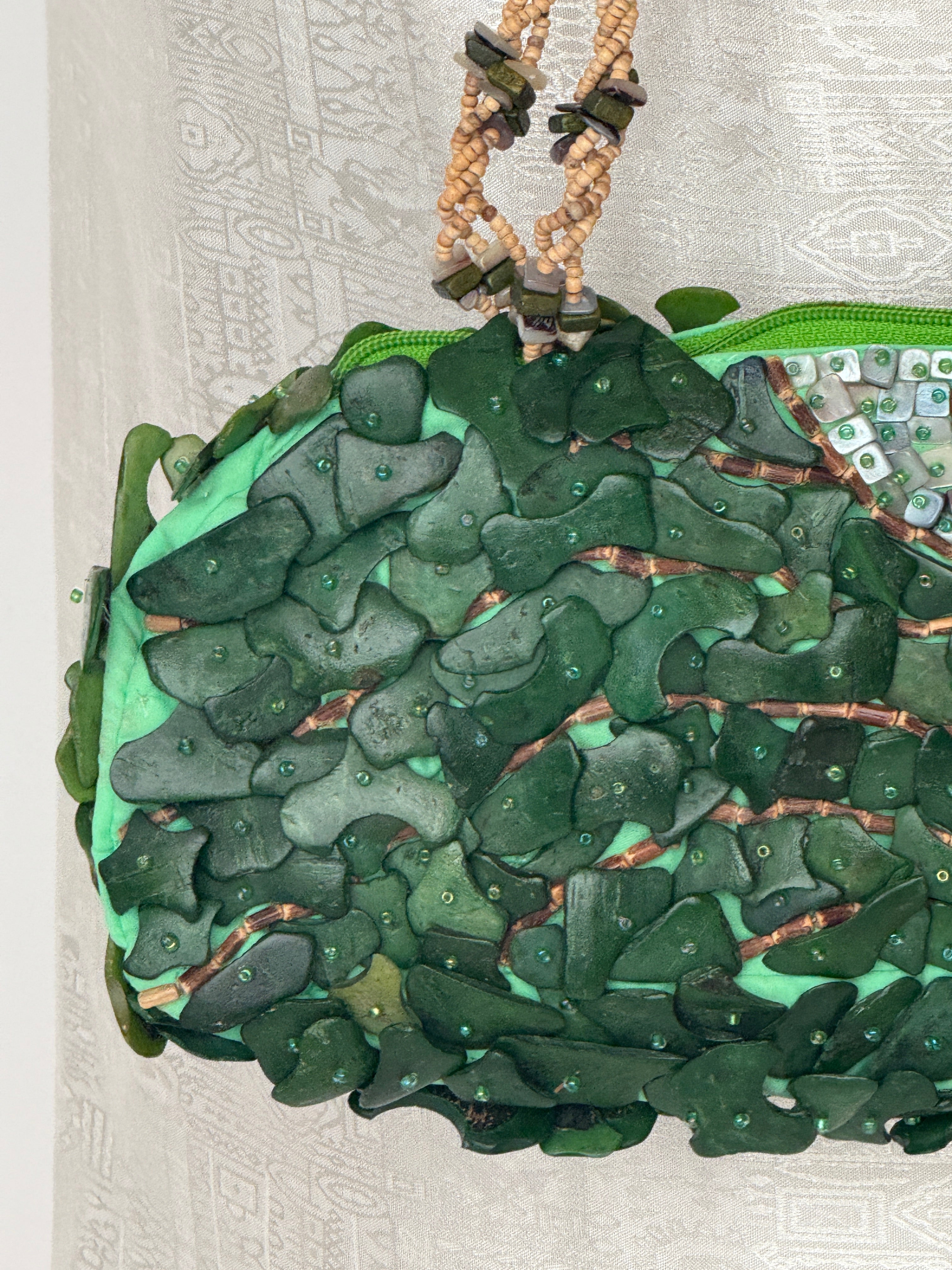 Vintage green mixed-media handbag texture detail