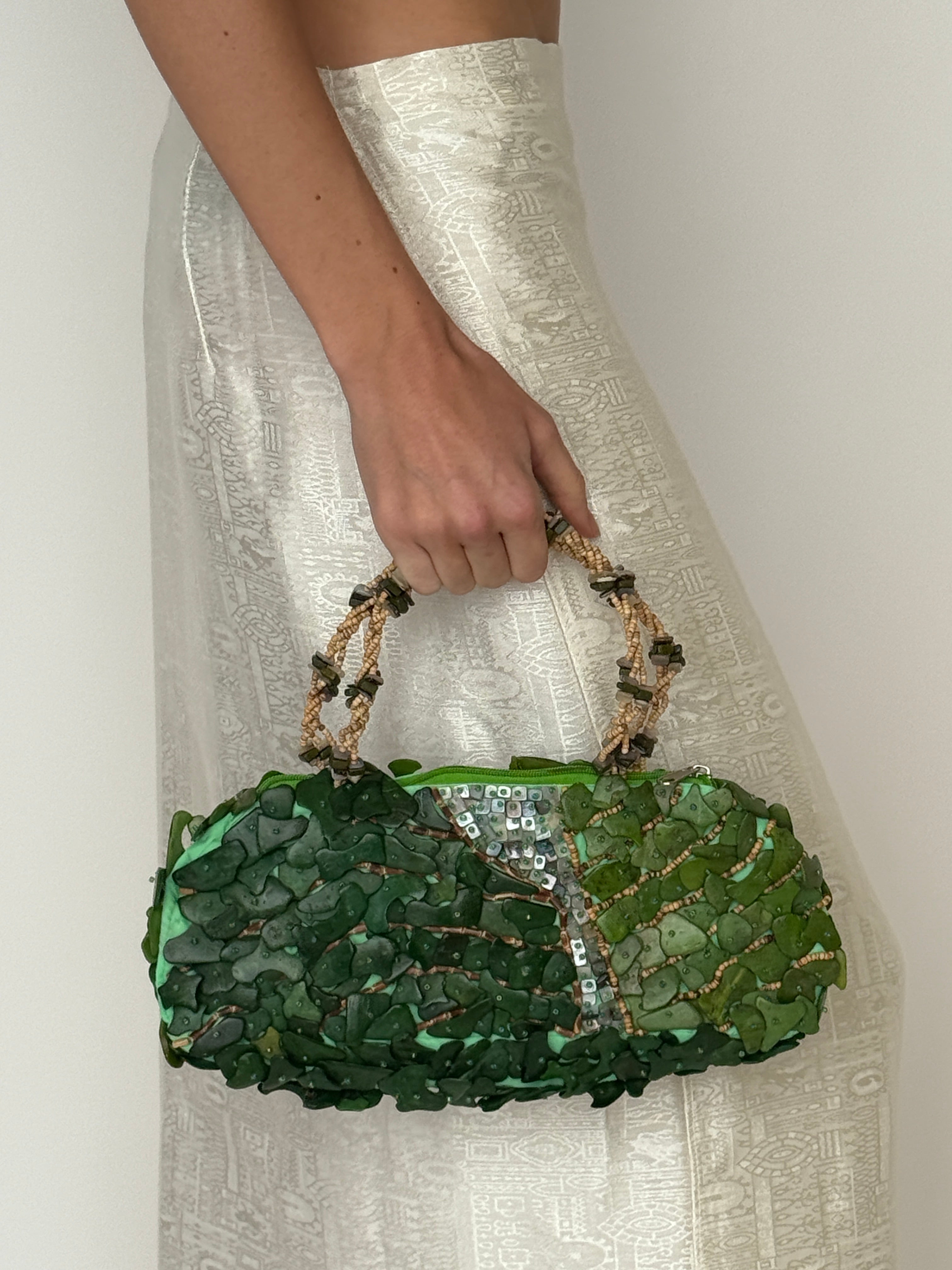 Vintage green beaded handbag carried on model