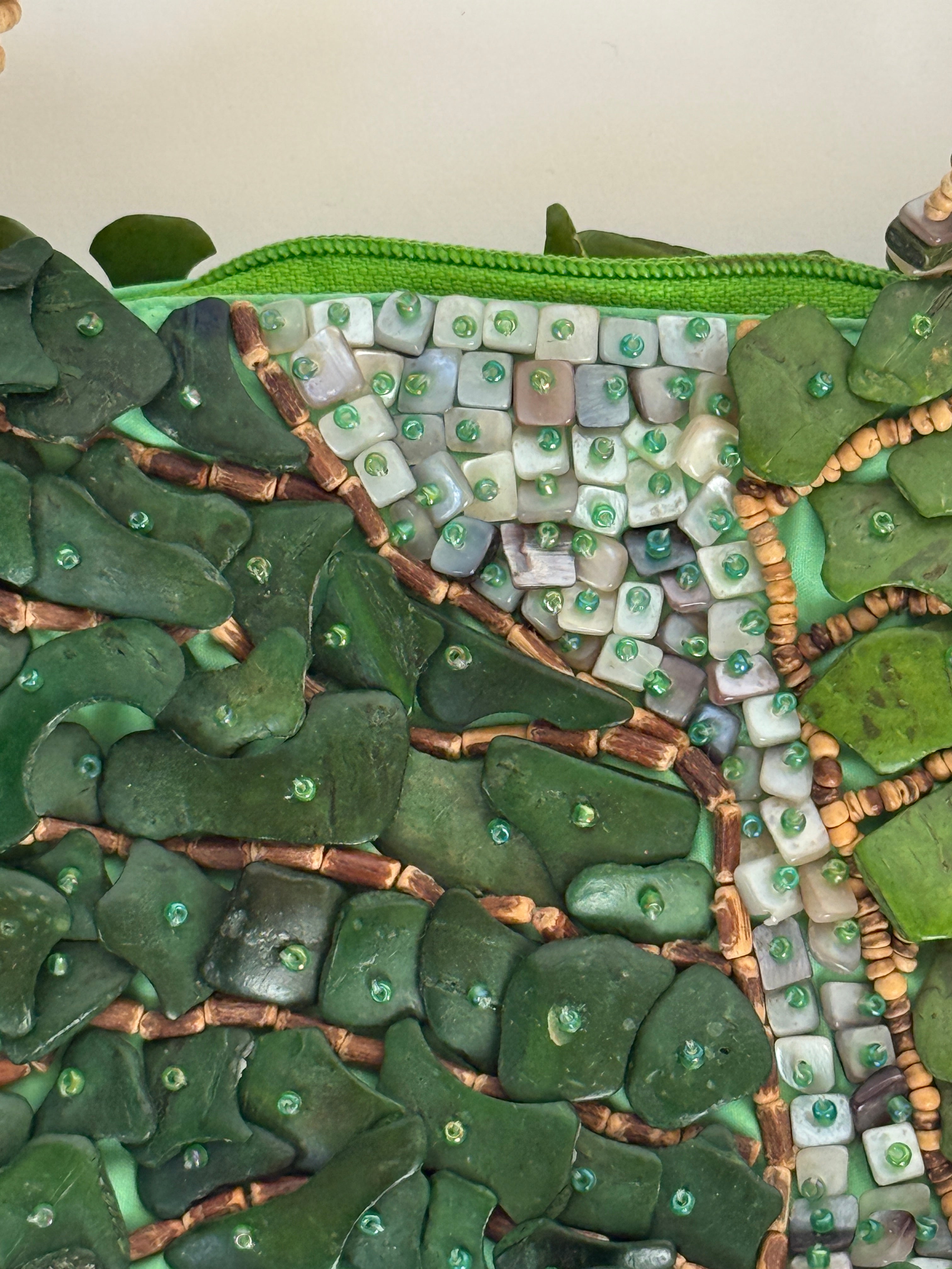 Vintage green handbag textured embellishment close-up