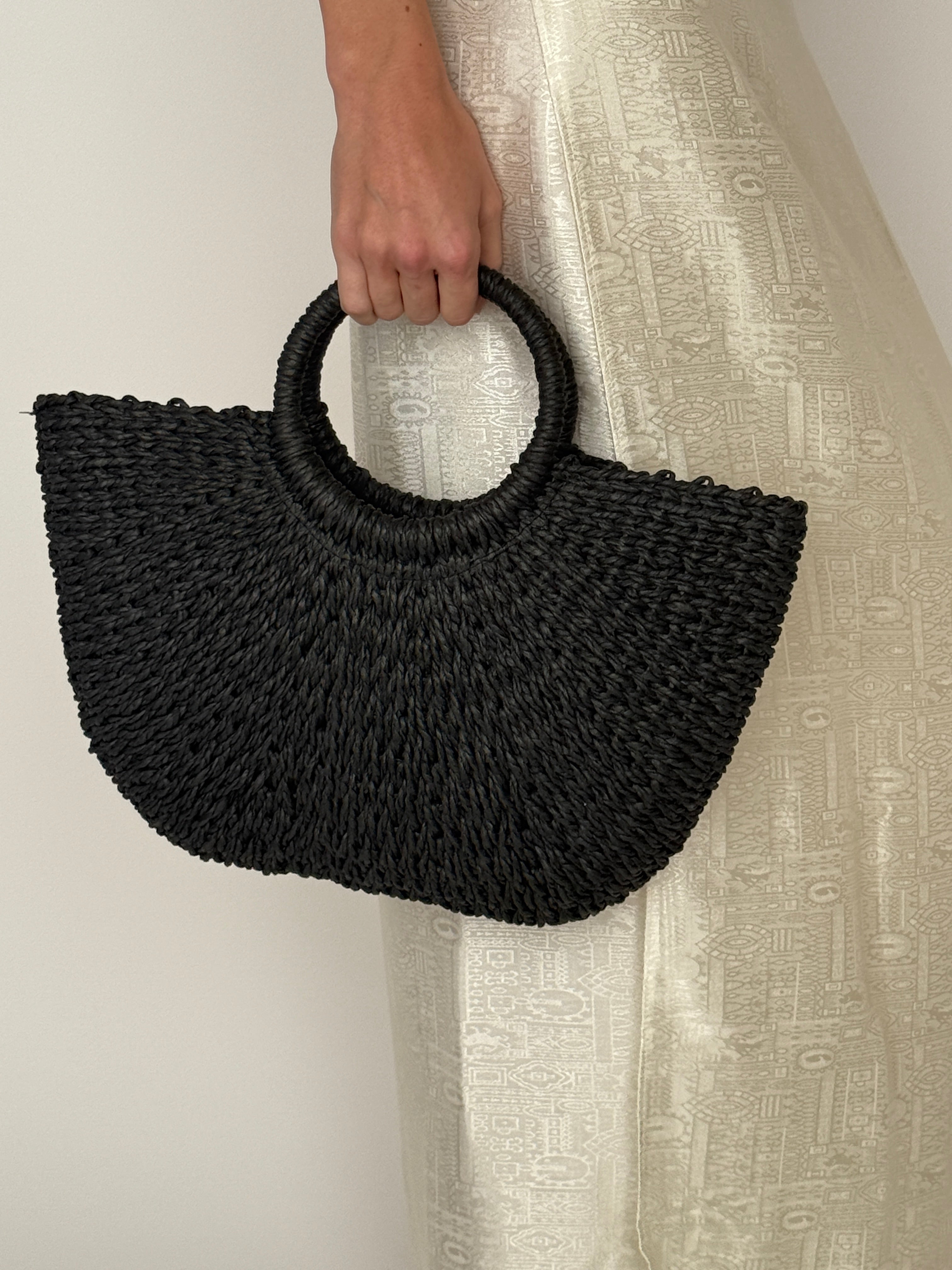 Vintage black woven straw handbag handle detail