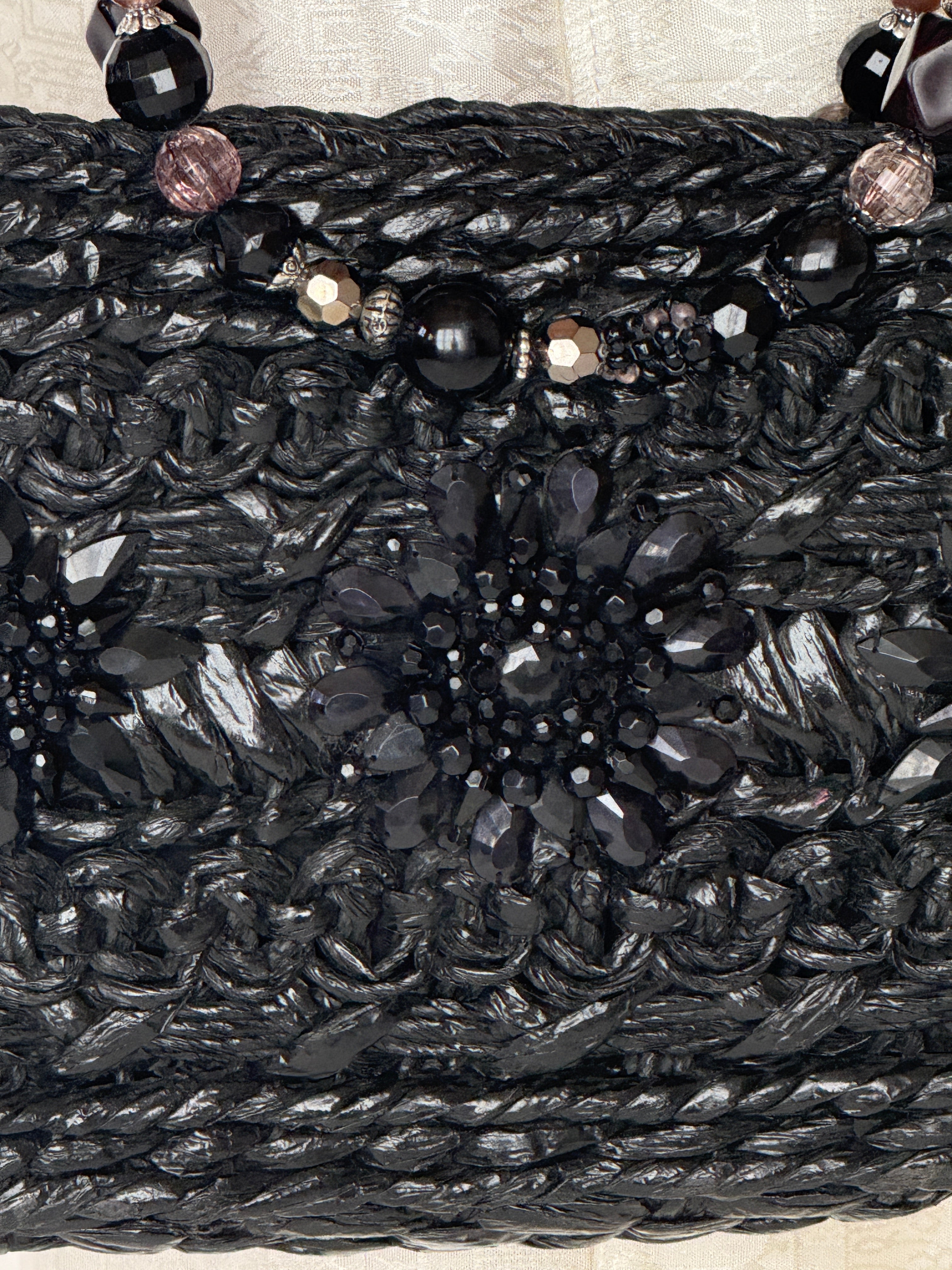 Vintage black woven handbag texture close-up