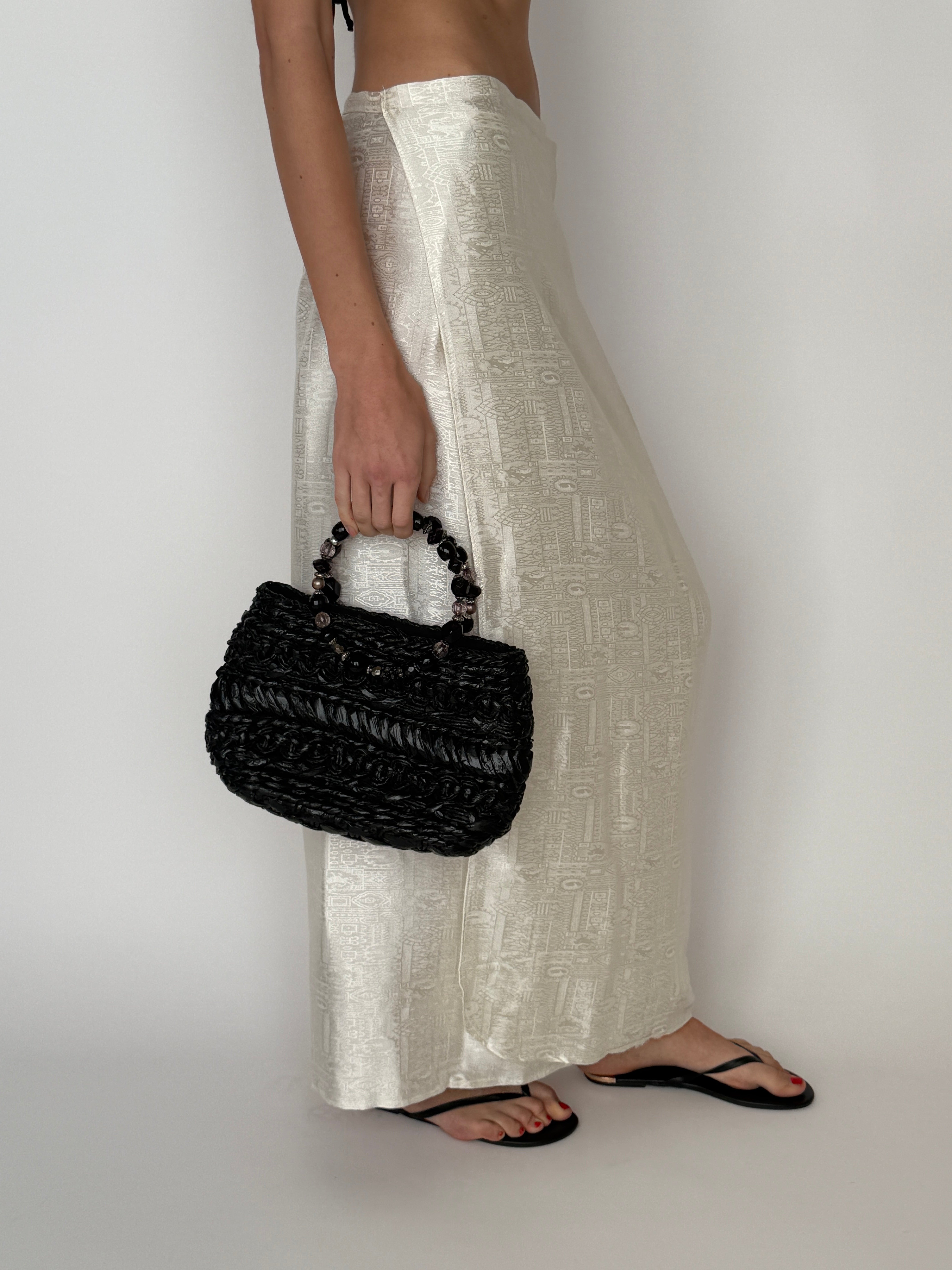 Vintage black woven beaded handle handbag front view