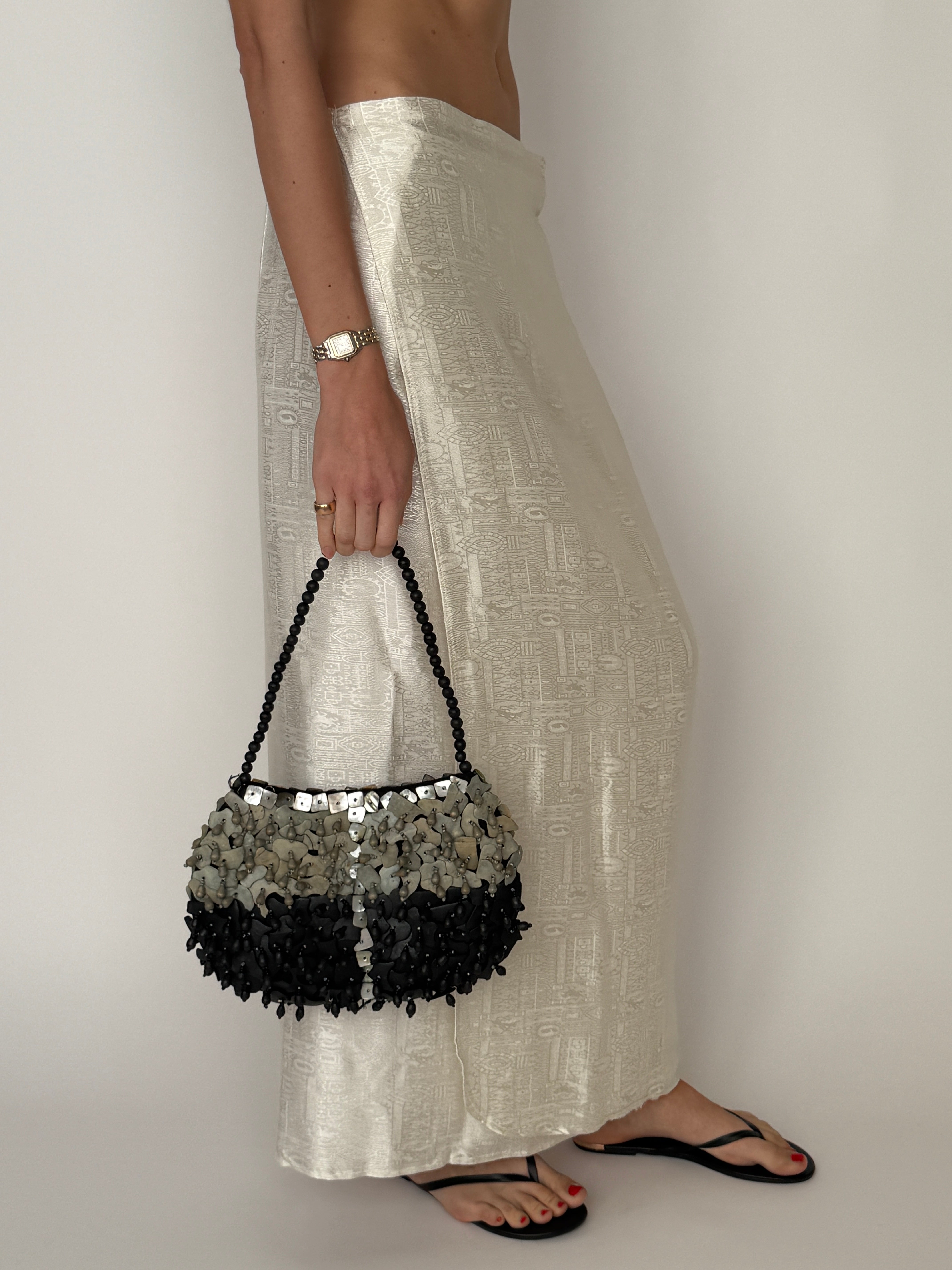 Vintage shell embellished handbag texture detail