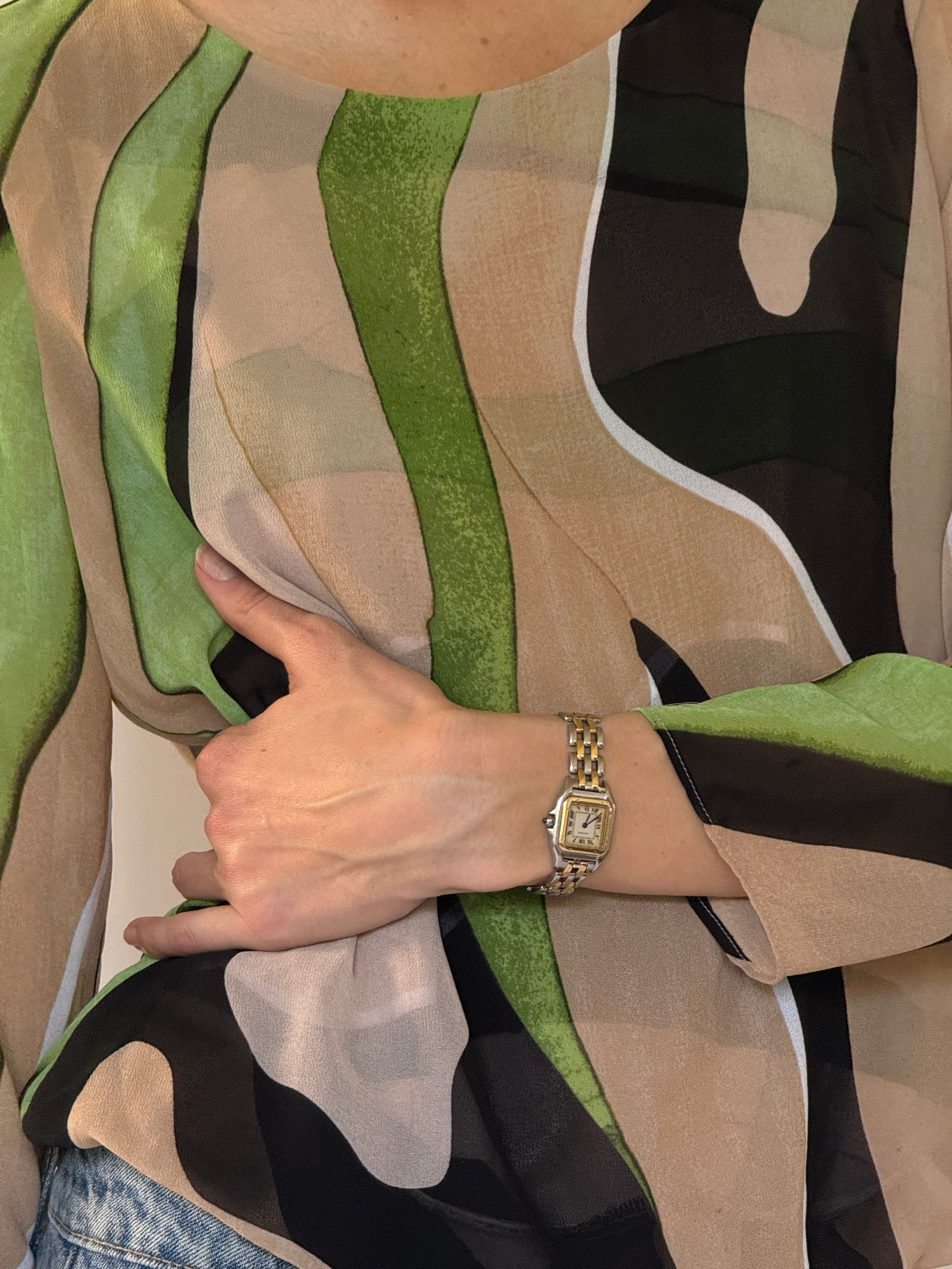 Vintage sheer fabric close-up with green print