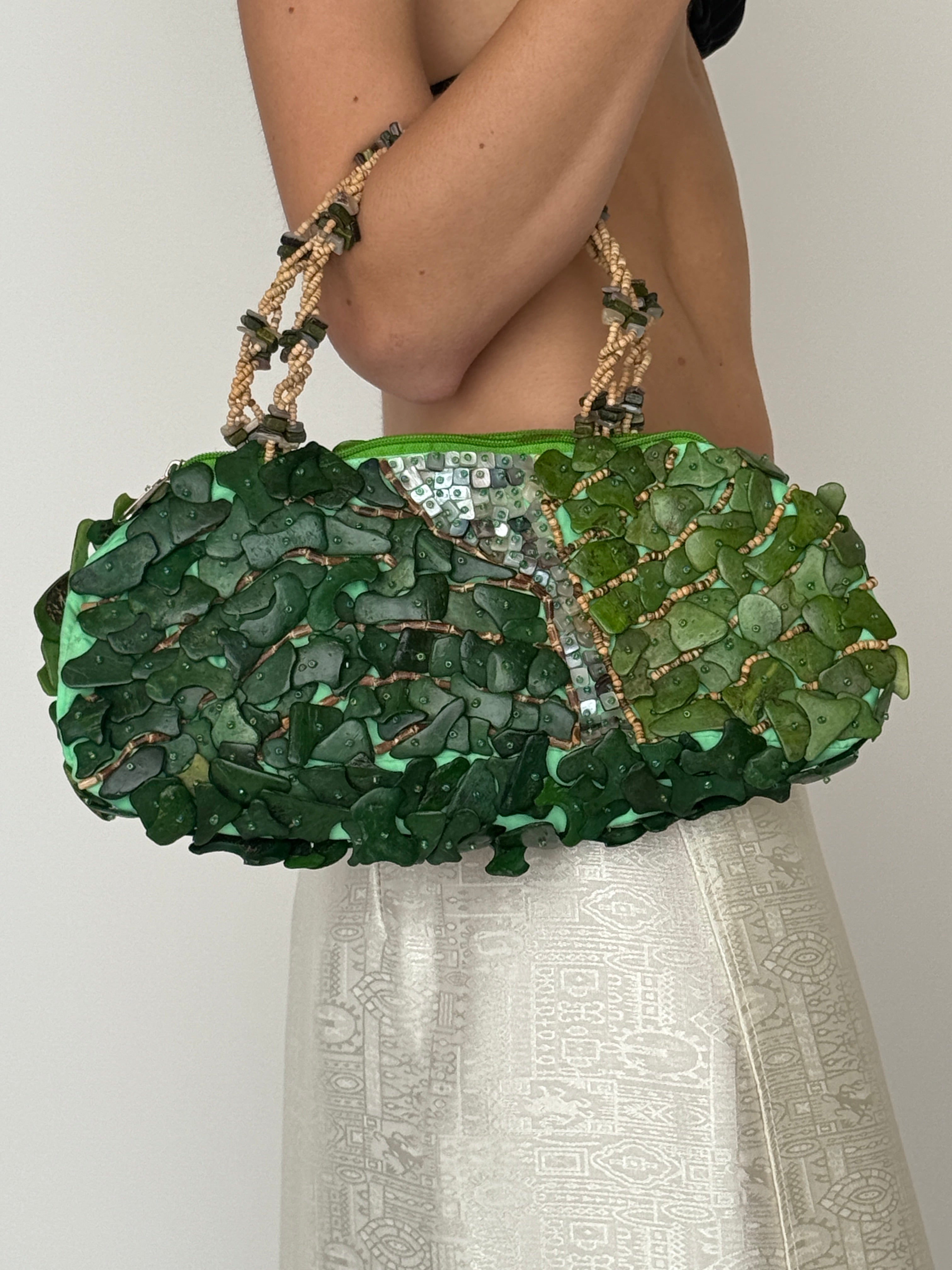 Vintage green beaded handbag carried on model