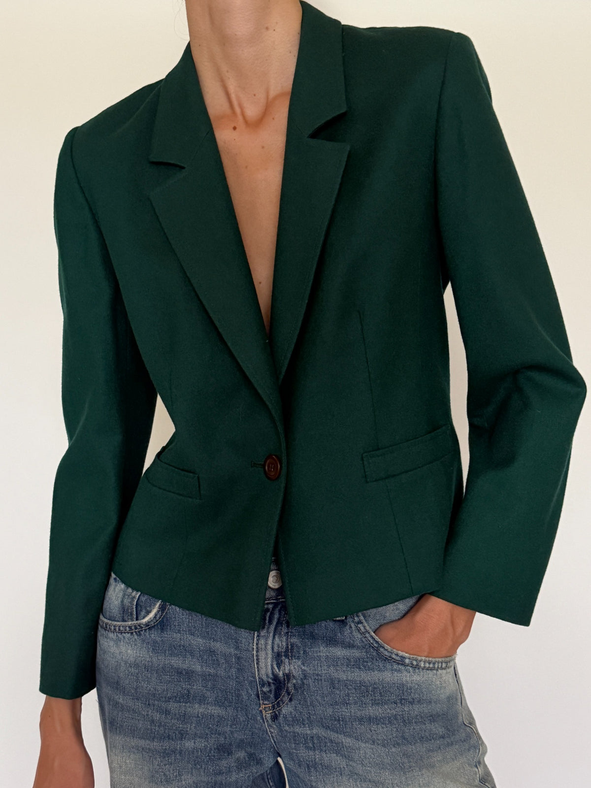 Front detail of single button tailored green blazer