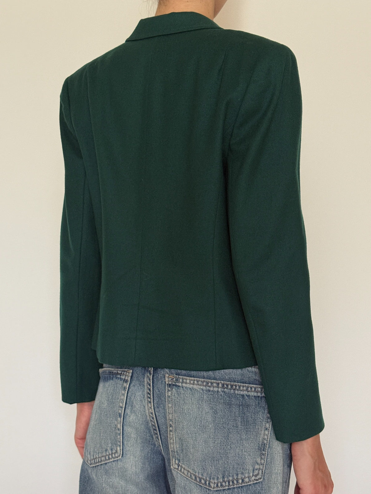 Back seams and shoulder details of wool blazer