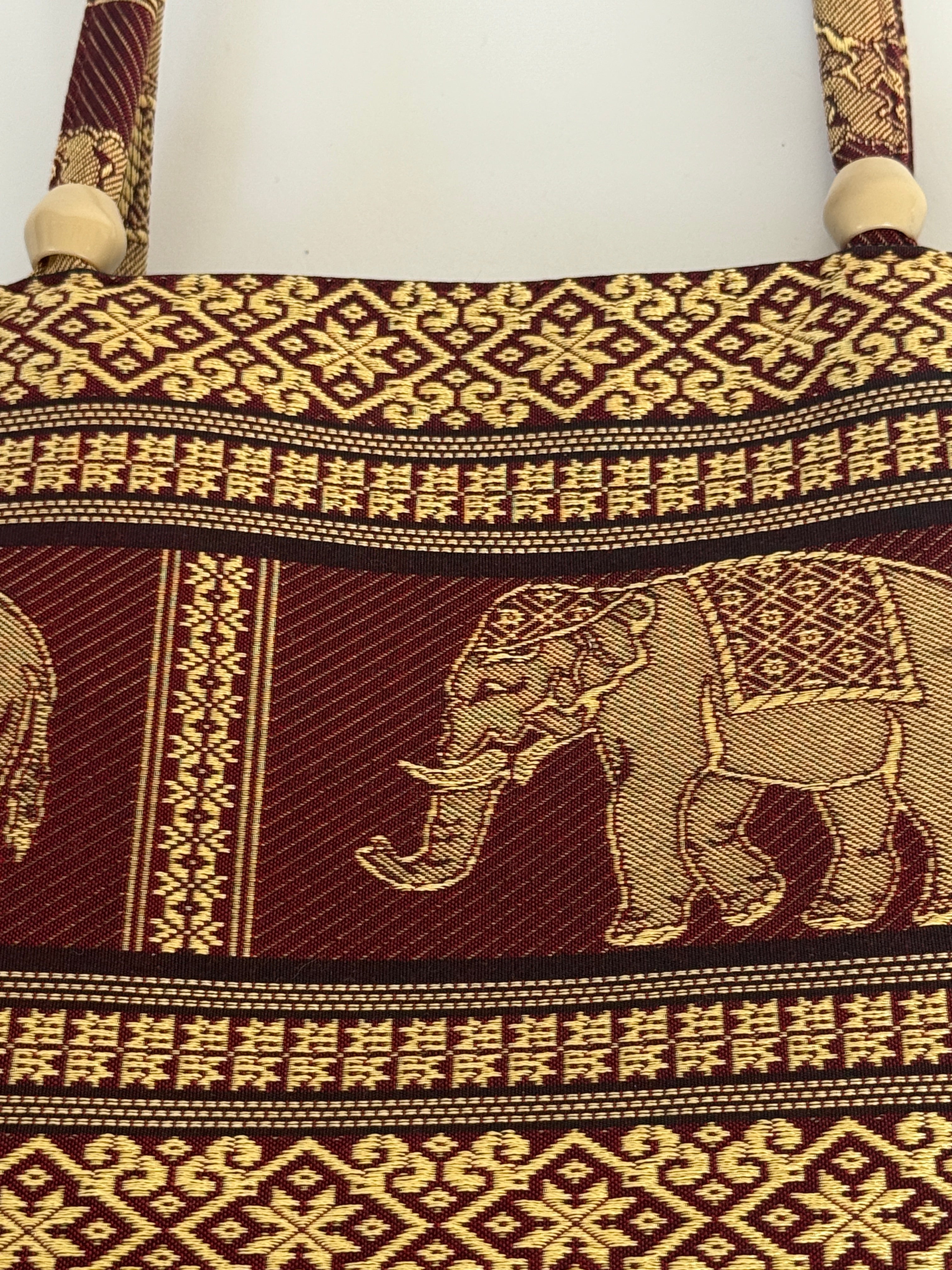 Vintage tapestry shoulder bag handle detail